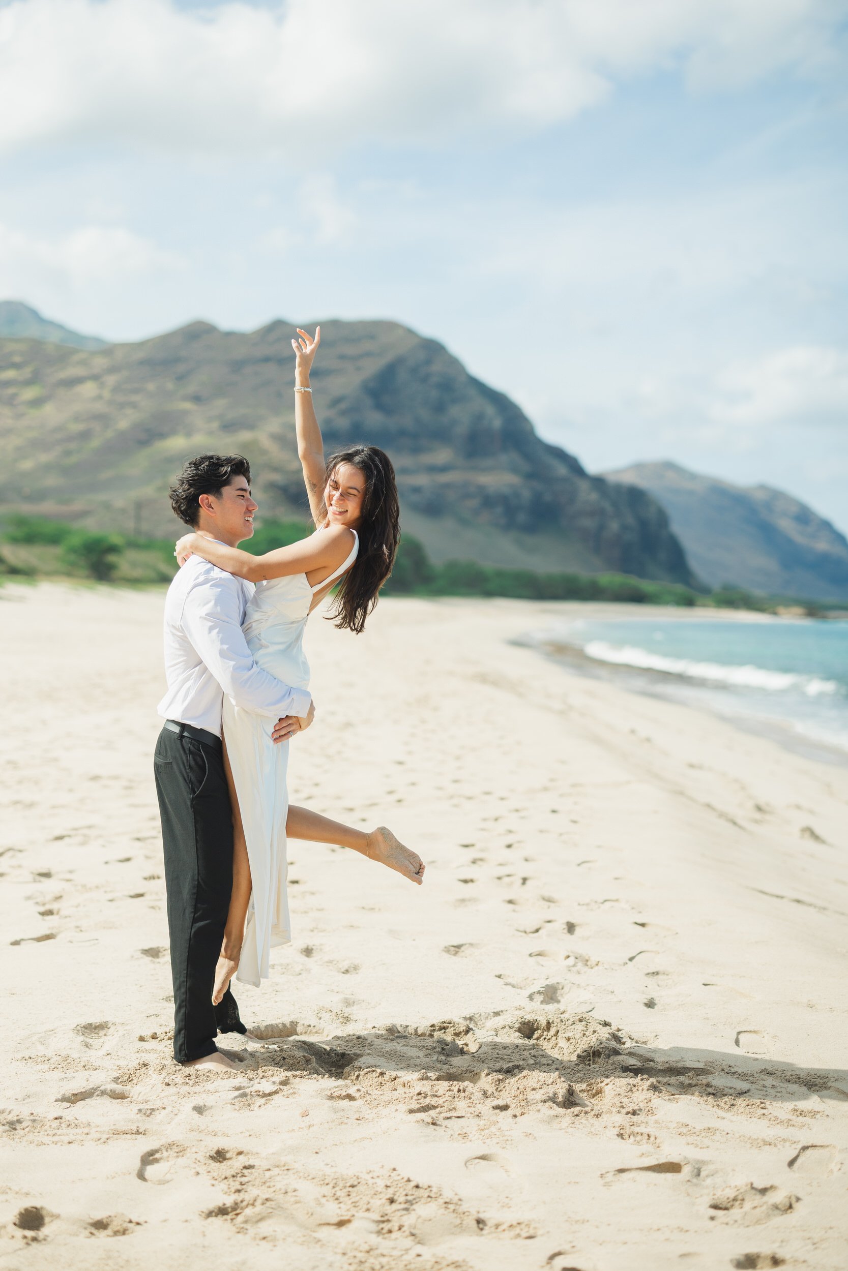 Candid couple moment during intimate Oahu beach elopement