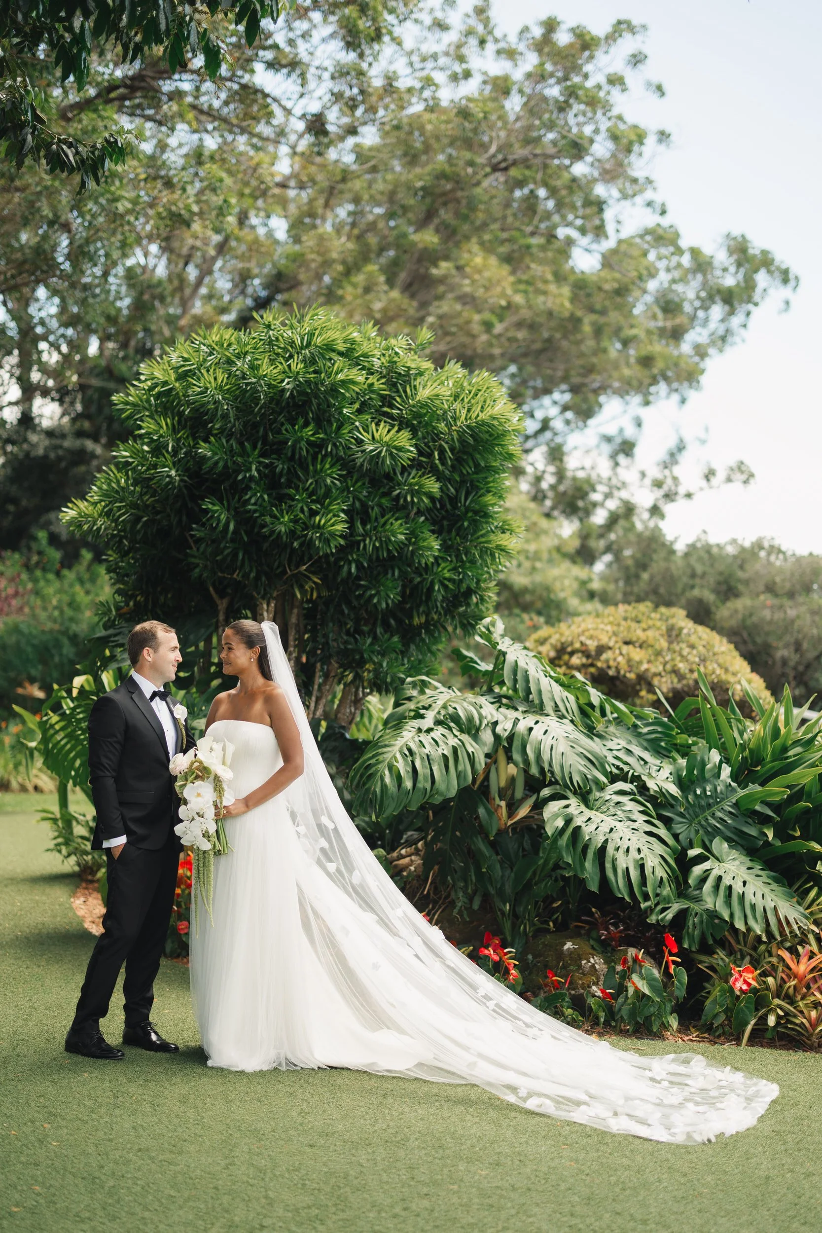 romantic couple portraits at sunset ranch hawaii overlooking the north shore of oahu