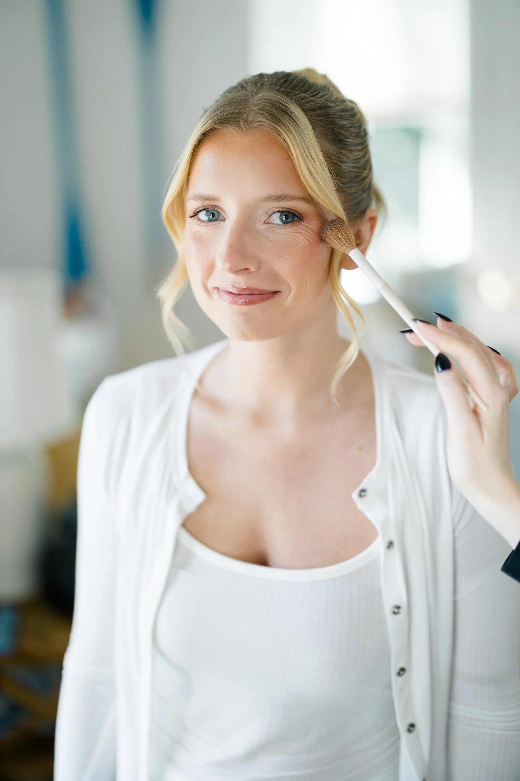 Bride getting ready on her wedding day at Wychmere Beach Club on Cape Cod.