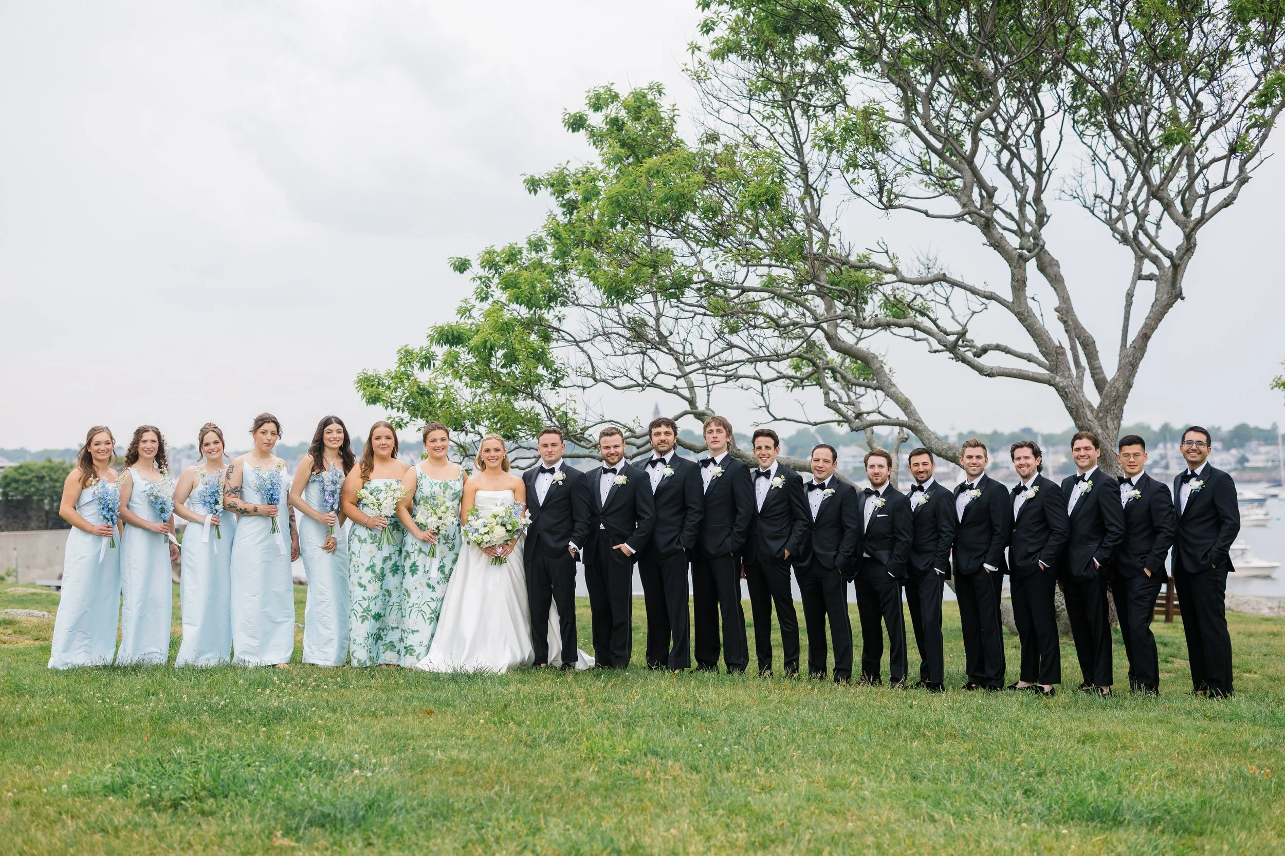 Bridesmaids and groomsmen gathered at a coastal New England wedding on the North Shore.