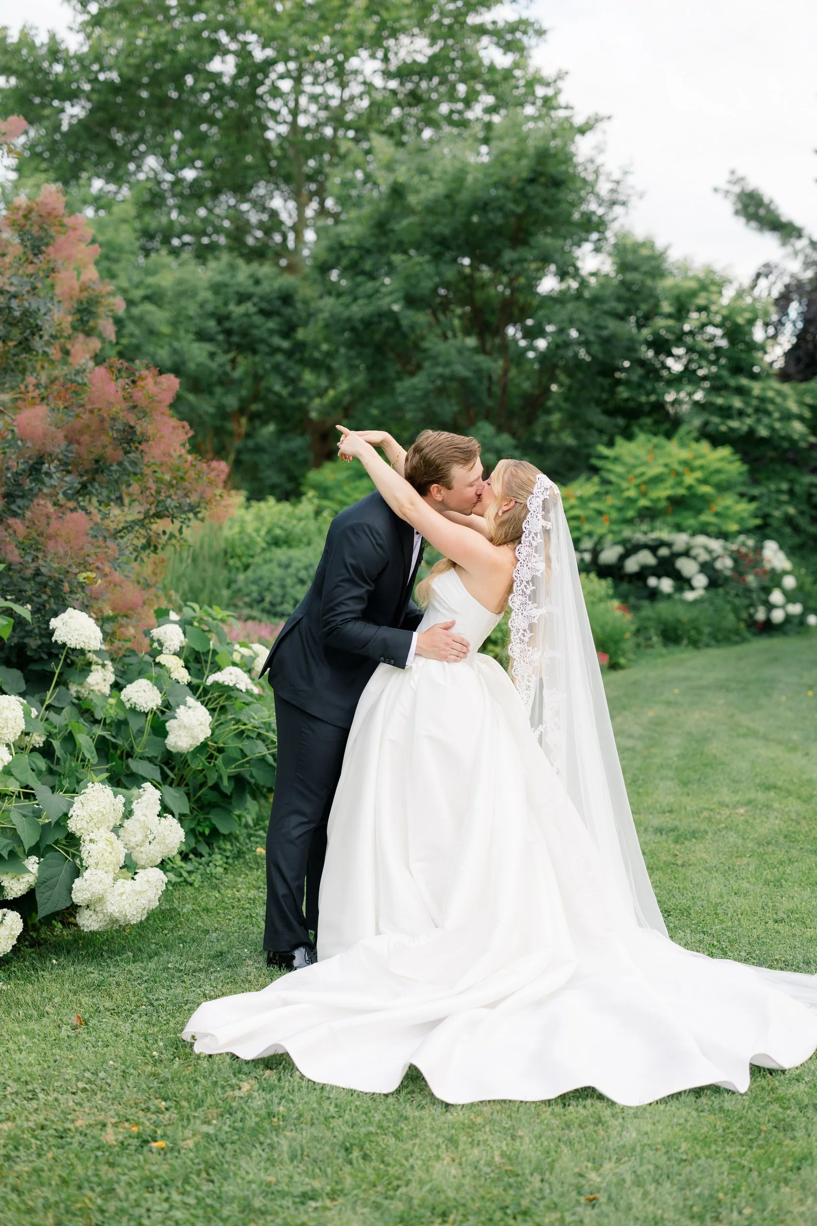 Newlywed couple during sunset portraits in the Italian Gardens at Elm Bank