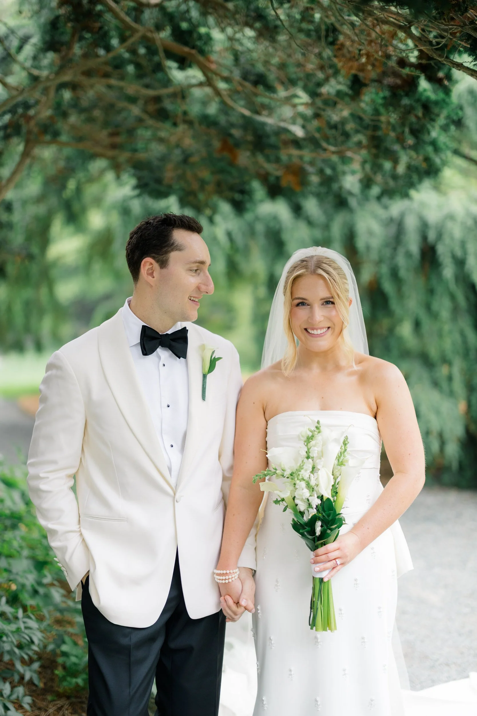 Bride and groom exploring the gardens during their Blithewold Wedding.
