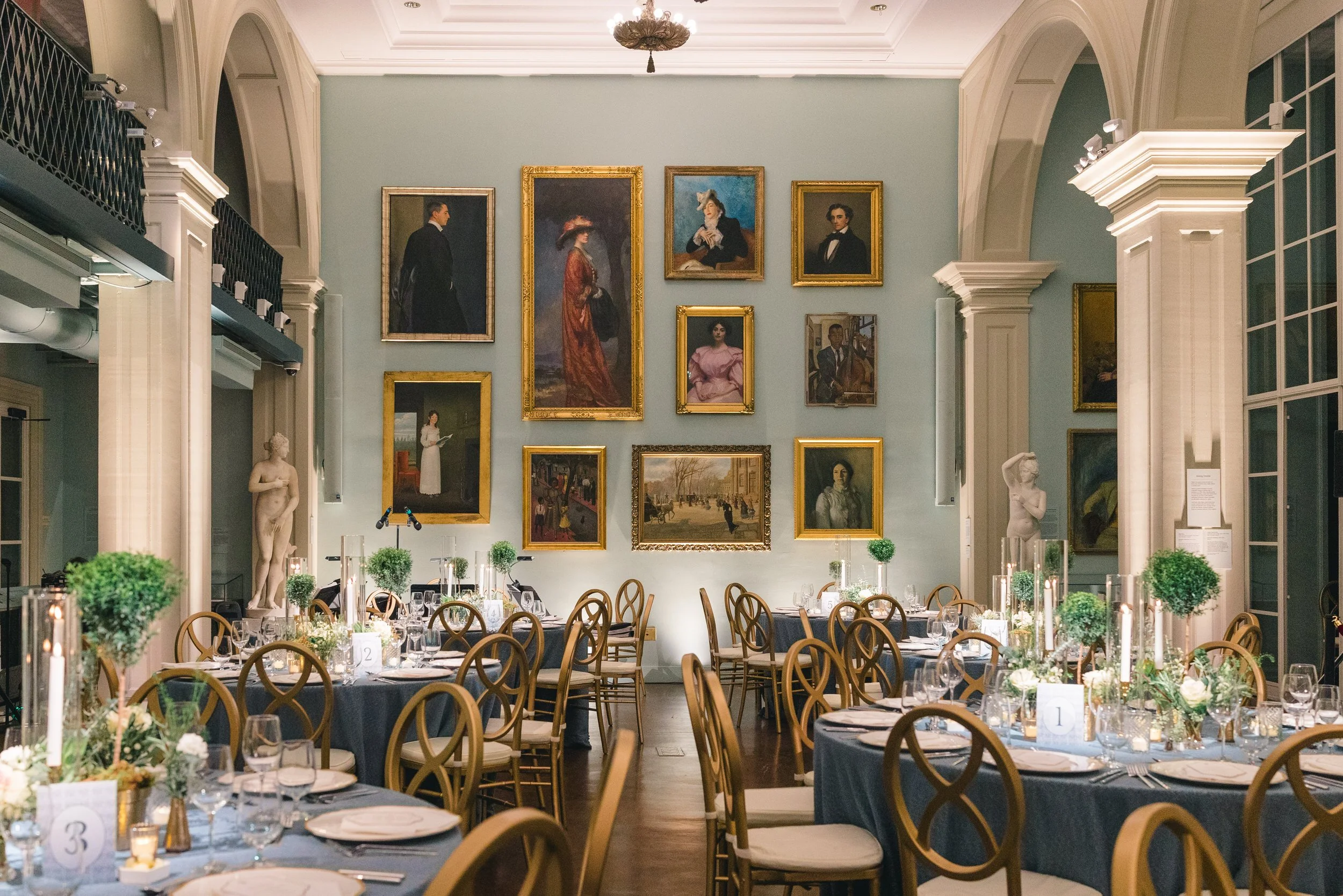 Romantic candlelit tablescape inside the Boston Athenaeum