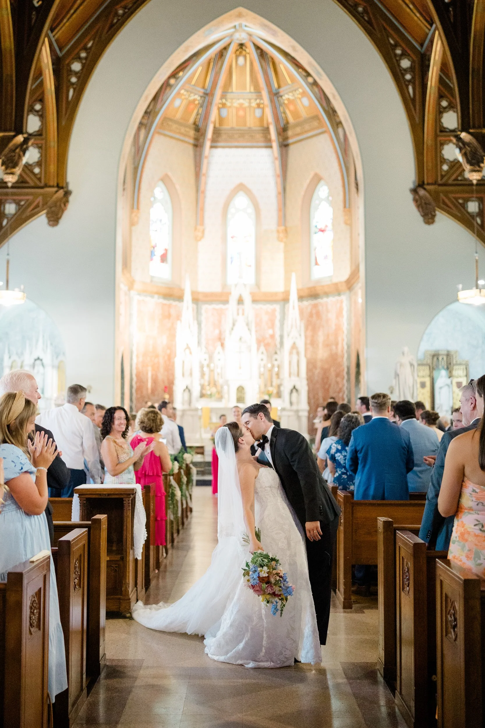 Newly married couple walking down the aisle after their ceremony.