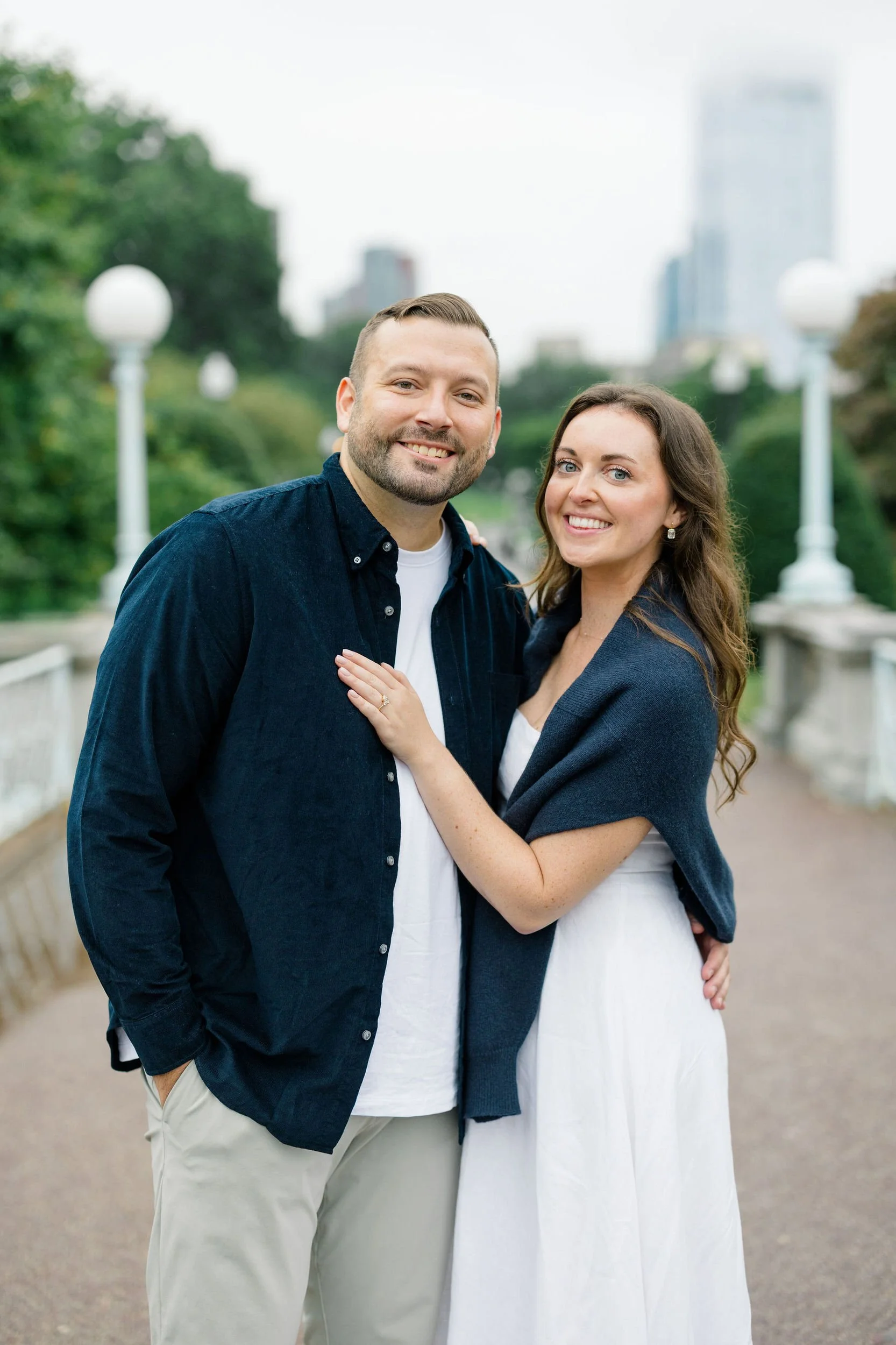 Couple walking through the Boston Public Garden during an engagement session