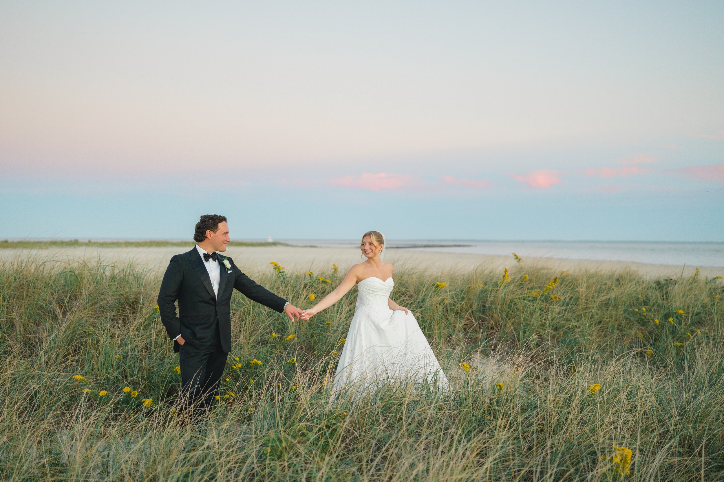 Romantic coastal wedding portraits at sunset on Cape Cod.