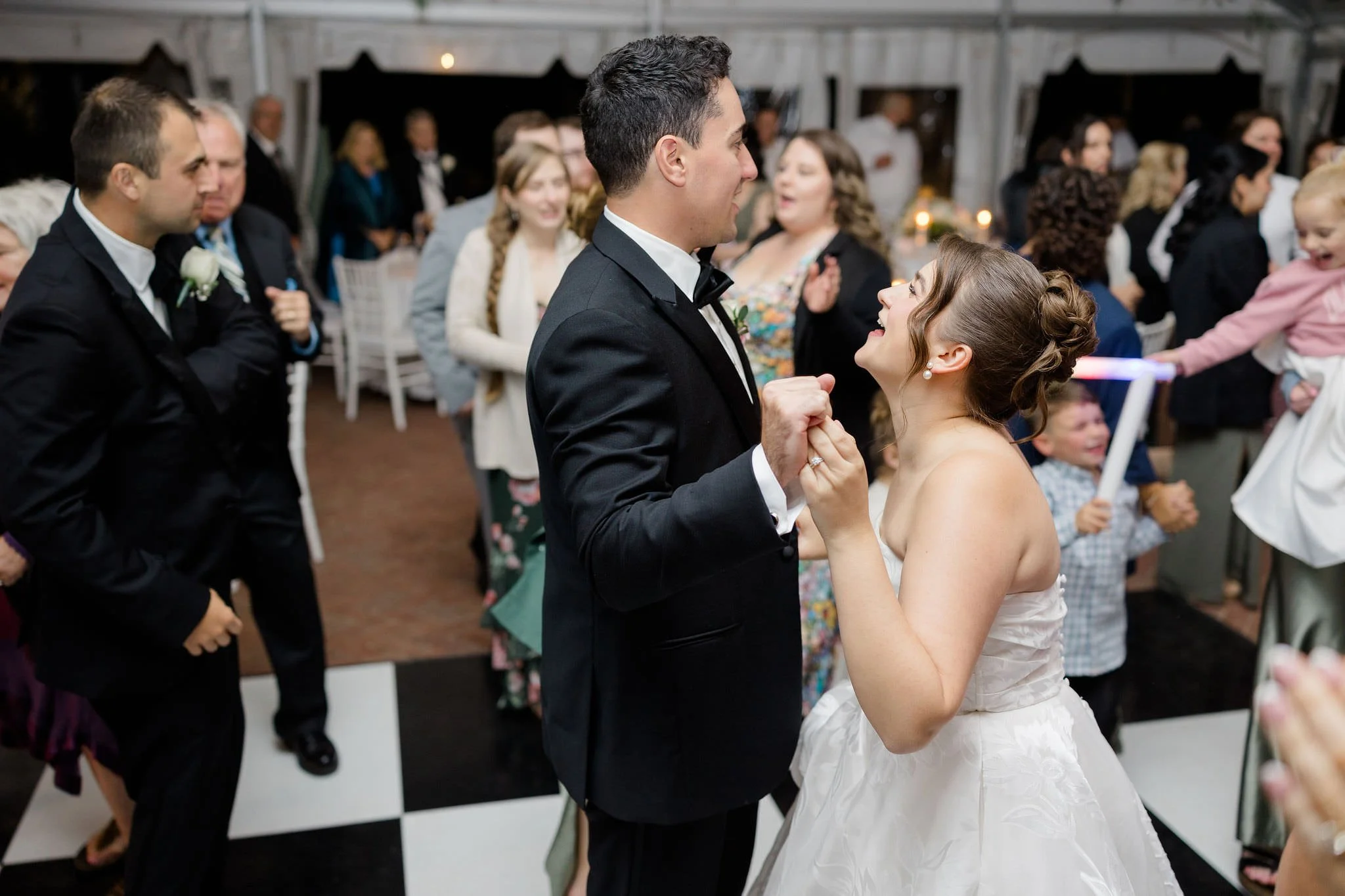 Couple dancing together during their Long Hill garden wedding celebration.
