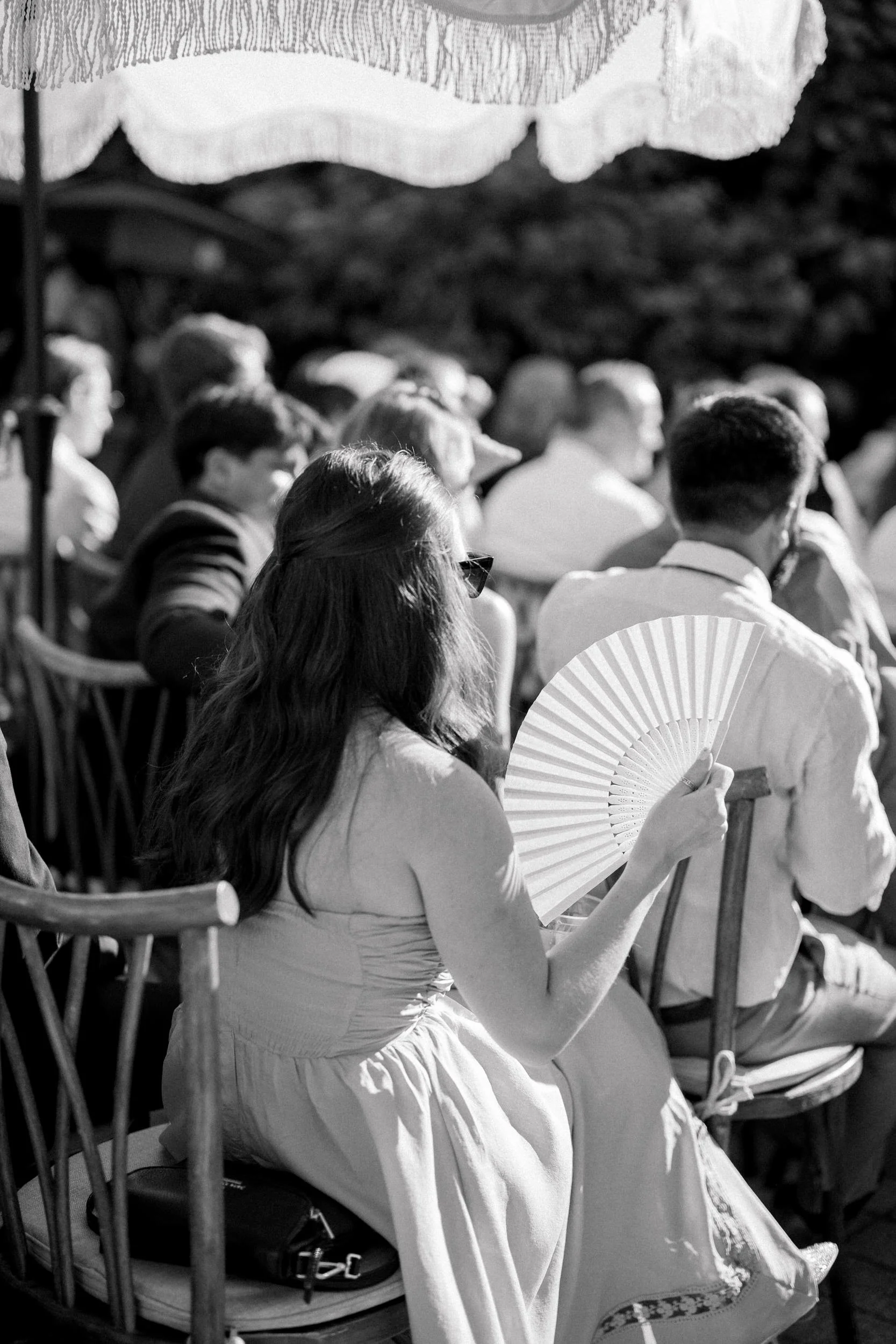 Guests watching wedding ceremony in garden setting at Massachusetts estate wedding