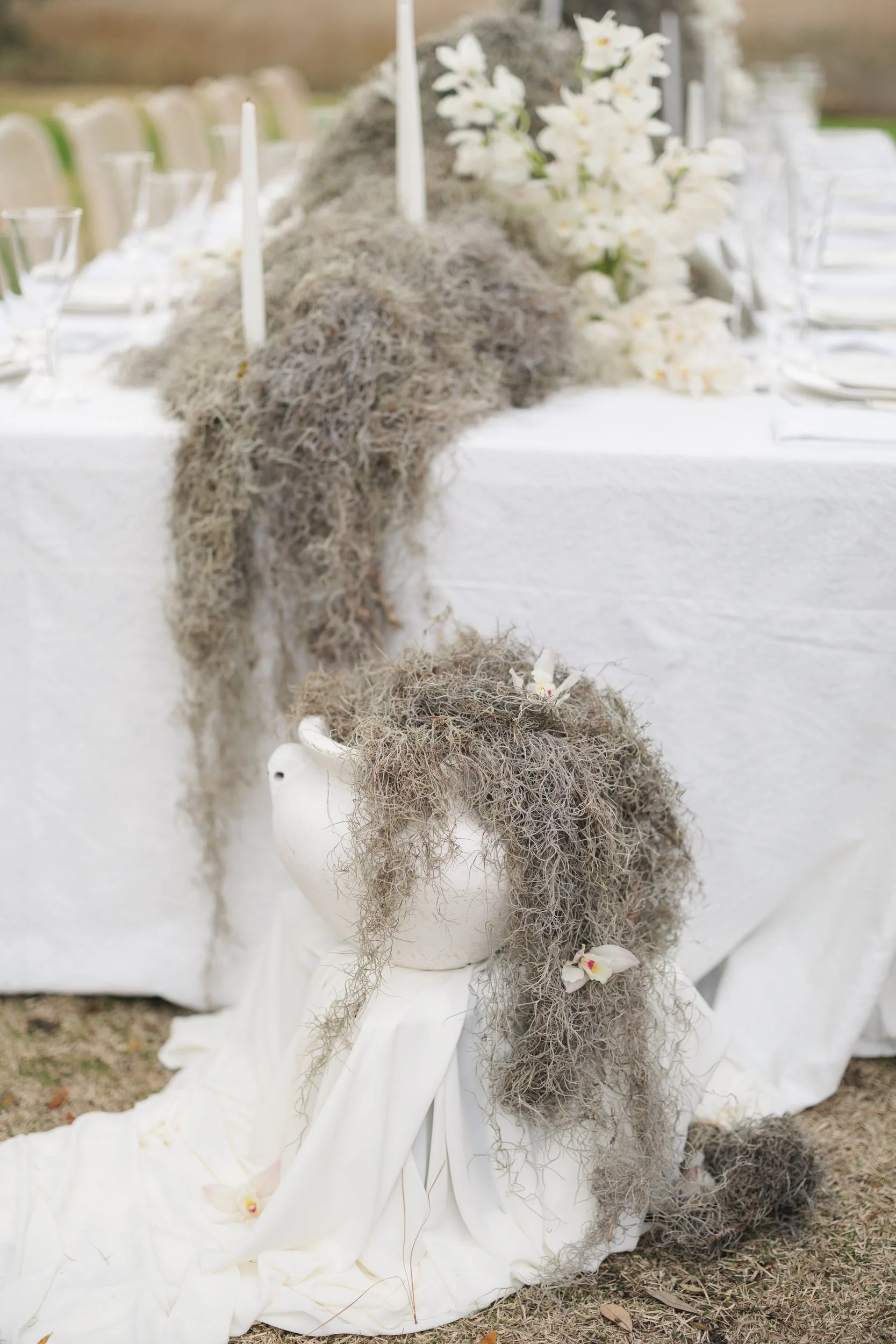 Lowndes Grove wedding reception table setting with soft neutral florals