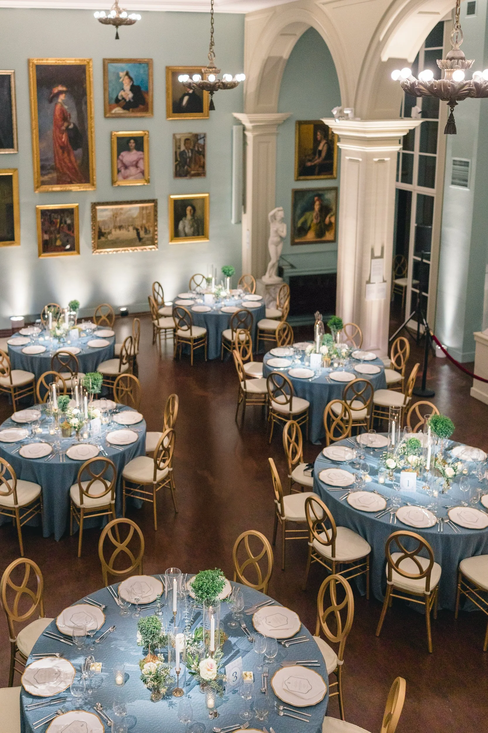 “Classic library-inspired tablescape with books, candles, and florals at the Boston Athenaeum