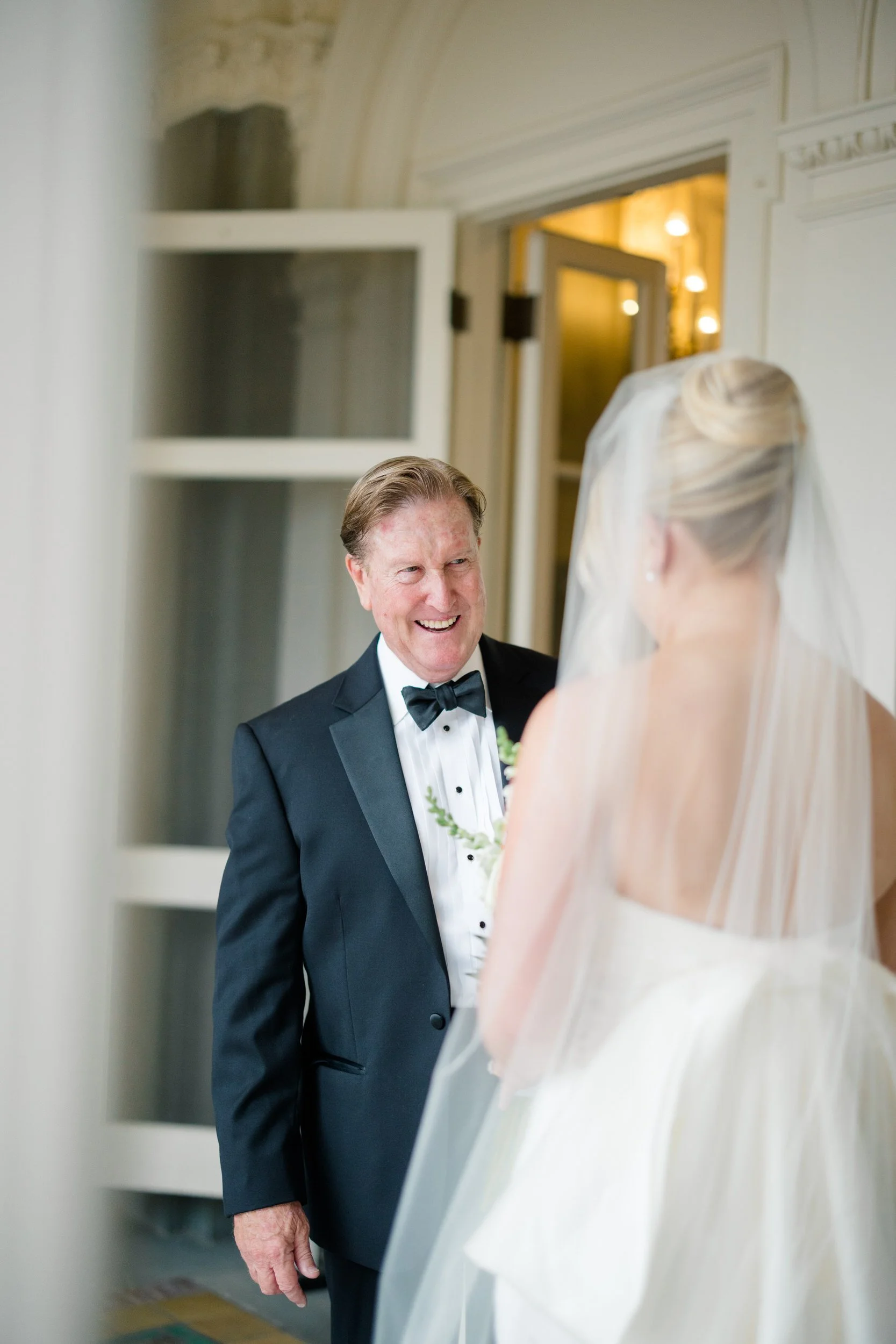 Documentary photograph of a bride and her father's first look before their Blithewold Wedding.