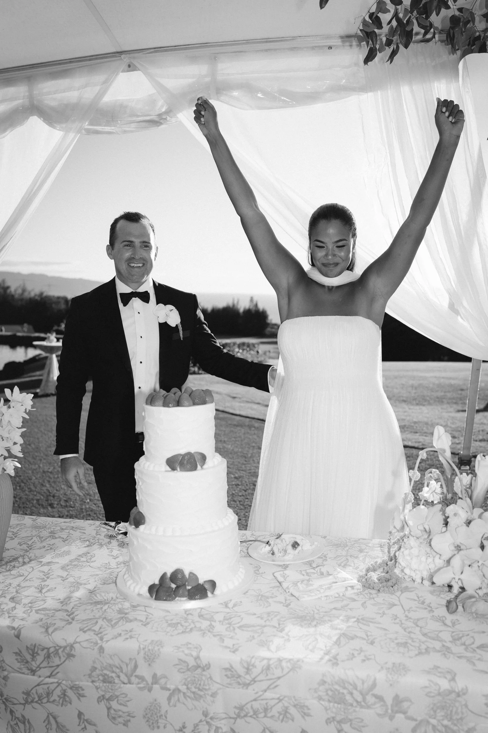cake cutting moment during oahu north shore wedding