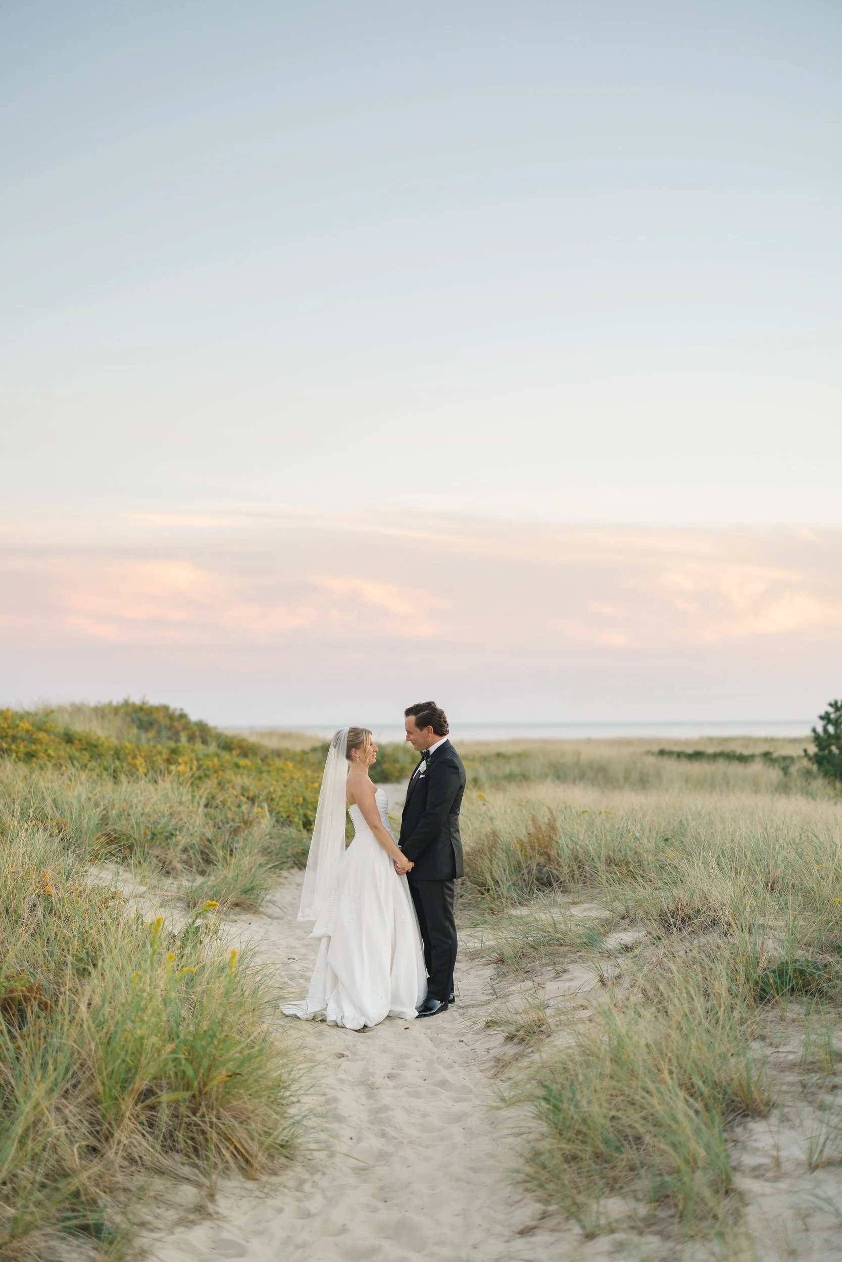Newlyweds photographed in the evening light at Wychmere Beach Club.