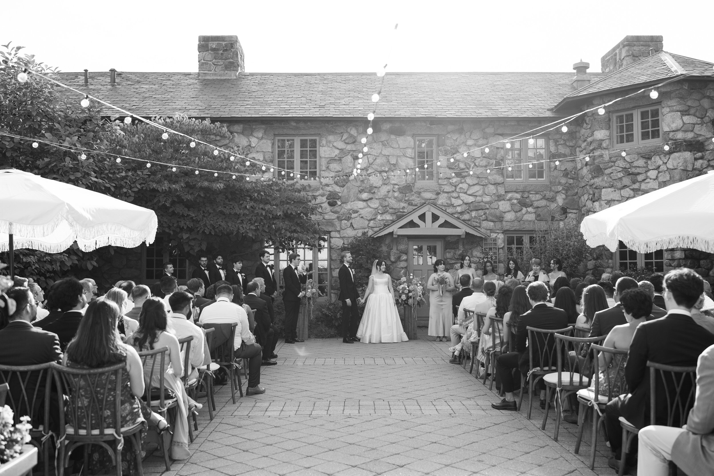 Bride and groom exchanging vows at outdoor ceremony at Willowdale Estate Massachusetts