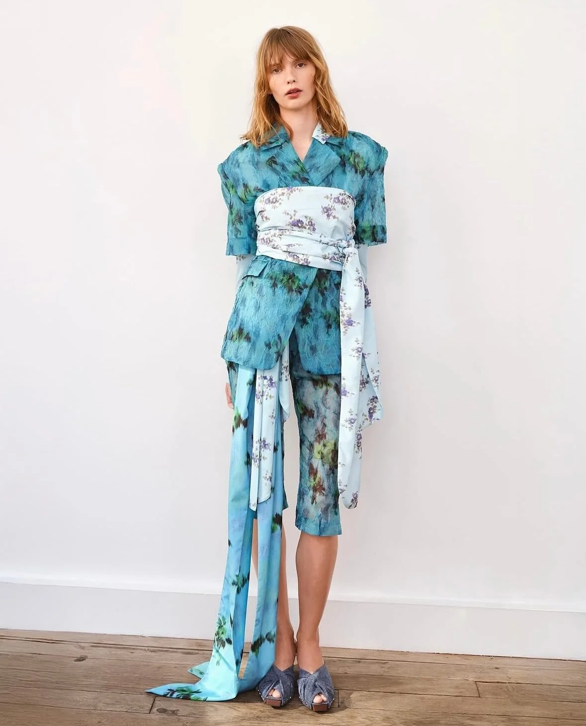 Ganni Spring 2026 Ready-to-Wear

Ganni unveiled its Spring 2026 collection at Paris Fashion Week under the creative direction of Ditte Reffstrup. Models posed in soft florals, layered looks, and rebellious details in a stunning presentation at the Ba