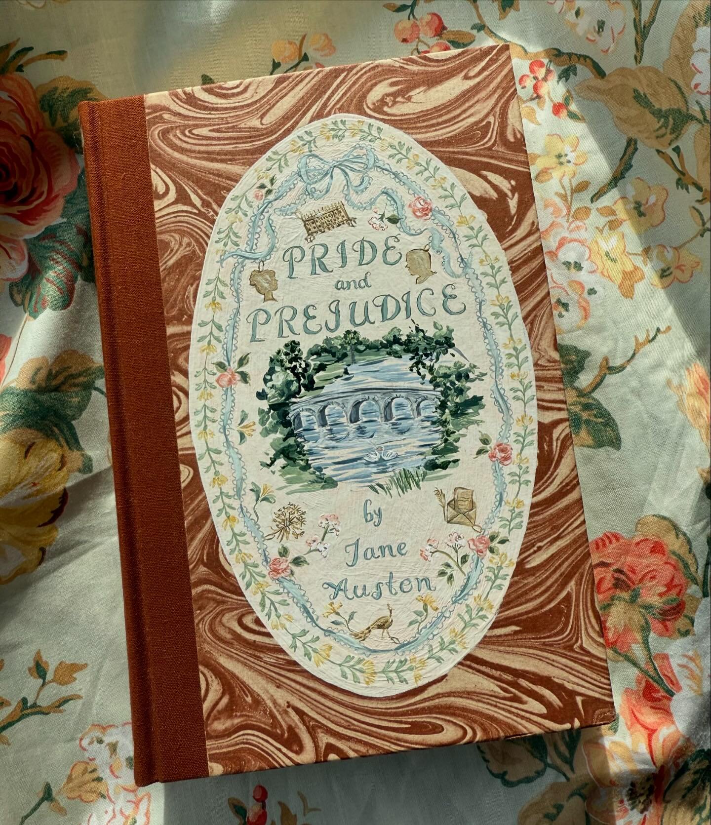 Handpainted vintage copy of Jane Austen&rsquo;s &ldquo;Pride and Prejudice&rdquo; 🎀 this will be available along with the others 12.6 at 10AM ET ✨ also- re: my poll in stories yesterday, Matthew Macfadyen will always be my Mr. Darcy (sorry Colin Fir