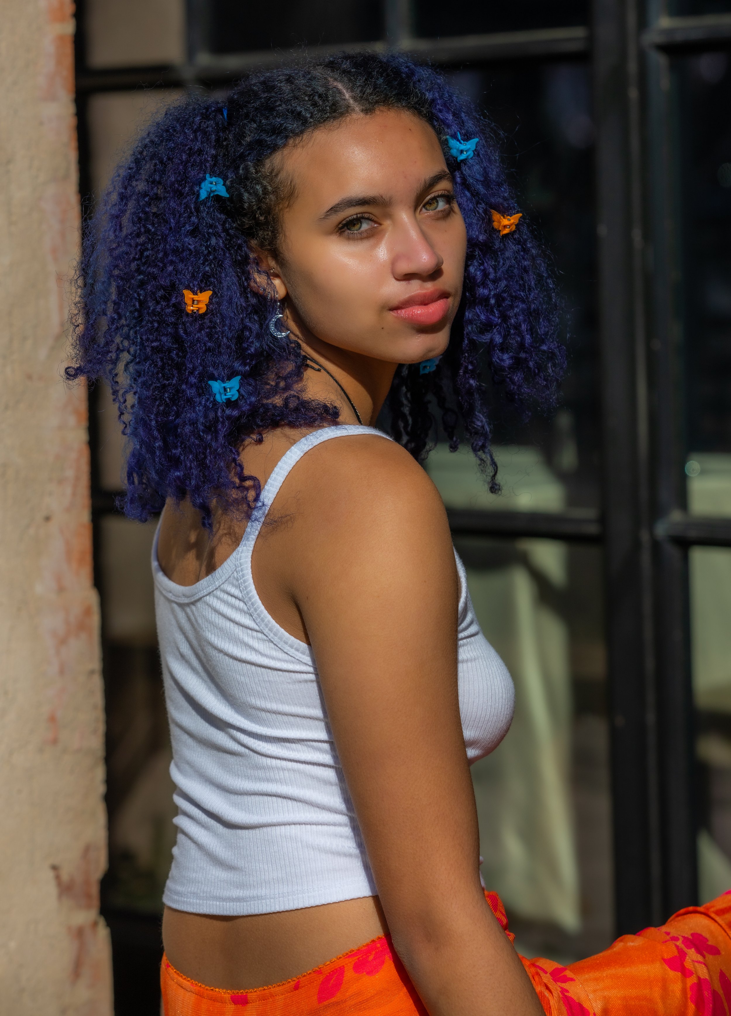 Taylor Hotel Outdoor Orange Skirt Looking Across Shoulder -1070.jpg