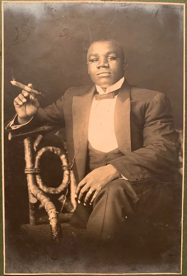 Sam was known a an excellent dresser and a love of cigars.