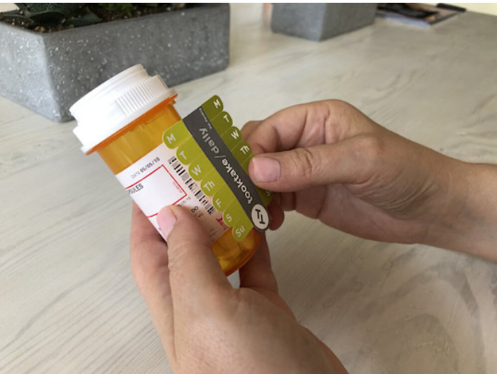 2. Place the label on the container.