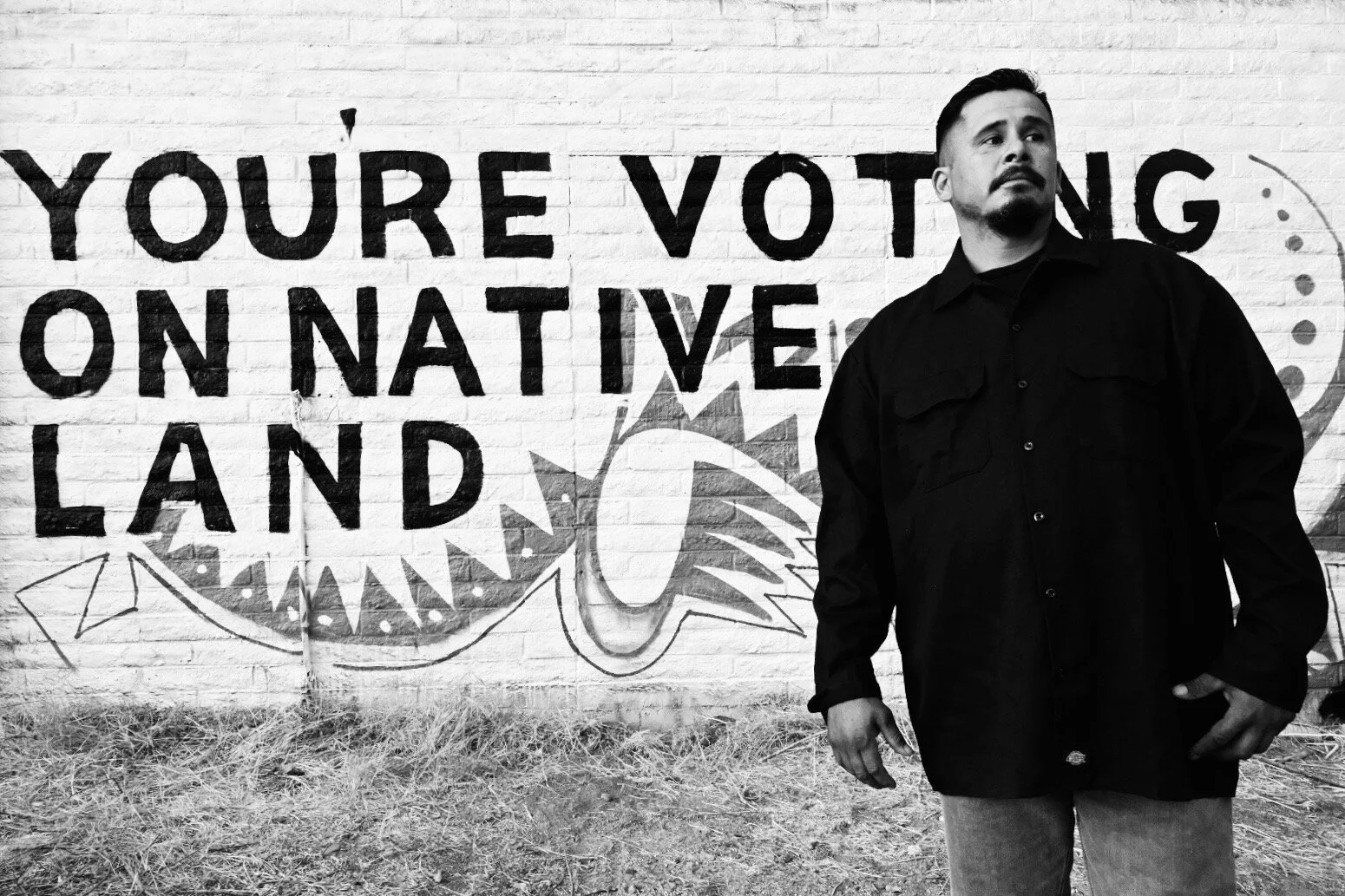    Portrait by Mural on the San Carlos Apache Reservation, Arizona   | Douglas Miles (IG: @dmiles1_apache) | Commissioned by Culture Surge 