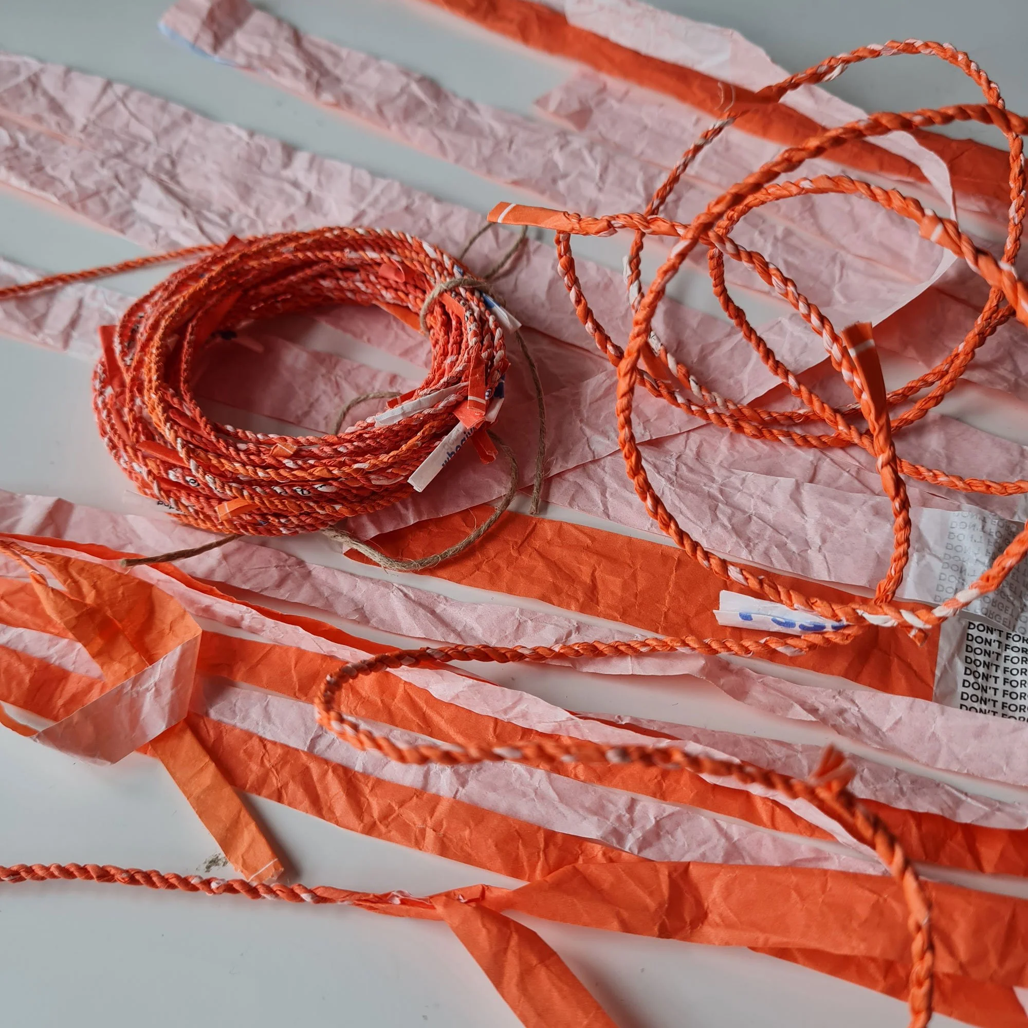 Handmade cordage with Who Gives A Crap 'emergency' toilet roll paper wrappers