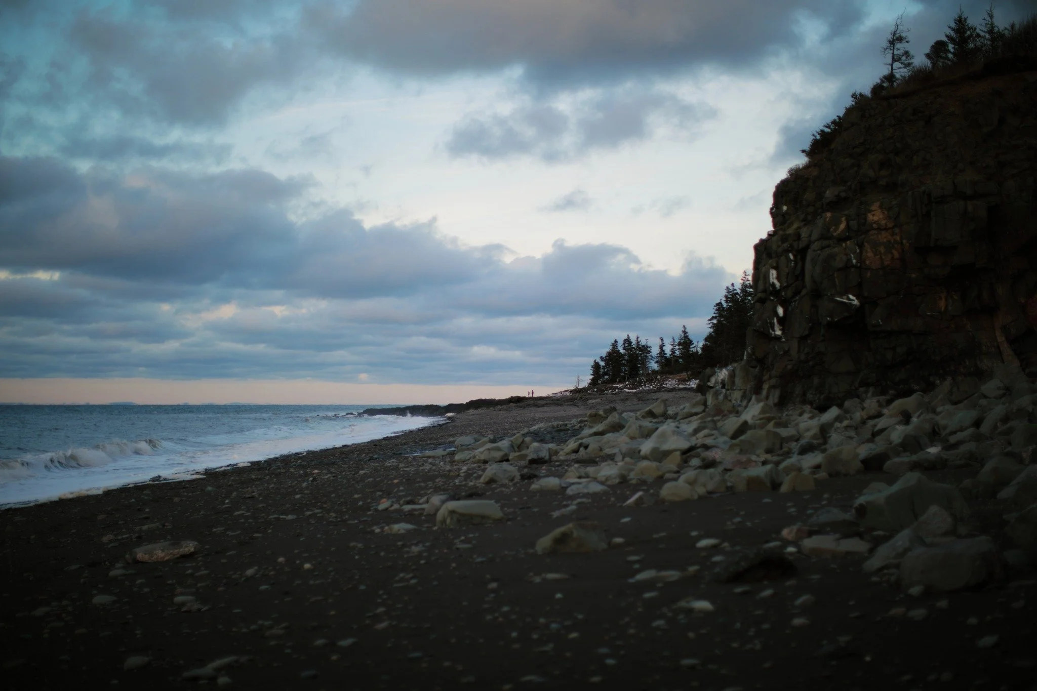 STANDS IN REALITY &mdash;&mdash; You can't hardly see it, but there are two figures standing on the rocks in the distance. We spoke earlier in passing, before they headed off as the wind chill got to them. They're just as far away from you, the viewe