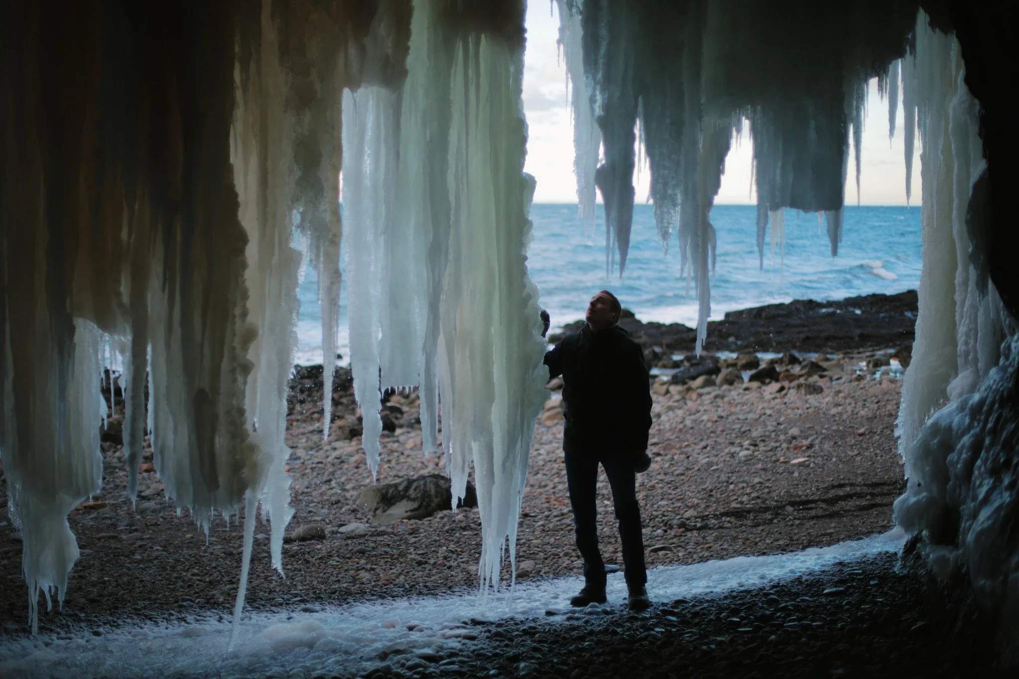 HOLY PLACES &mdash;&mdash; The vast canvas of colour in wild ice makes me more eager with enduring the cold. Mineral content and tannin dyes drip down slowly to towering icicles, bars on a beautiful cage. It's most compelling where the sea caves cove