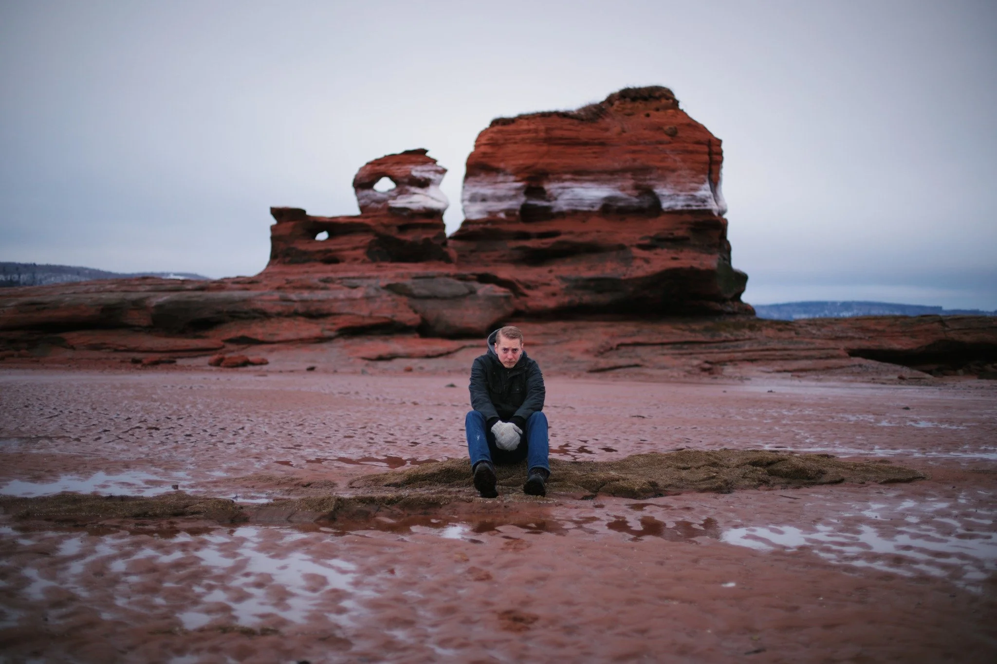 LINGERING UNDER &mdash;&mdash; It was a desolate day to go visiting Paddy's Island. The beach close in to shore was choked with ice and small, stranded bergs. A loose and uncertain surface to slip through. The wind was biting, harsh and howling, remi