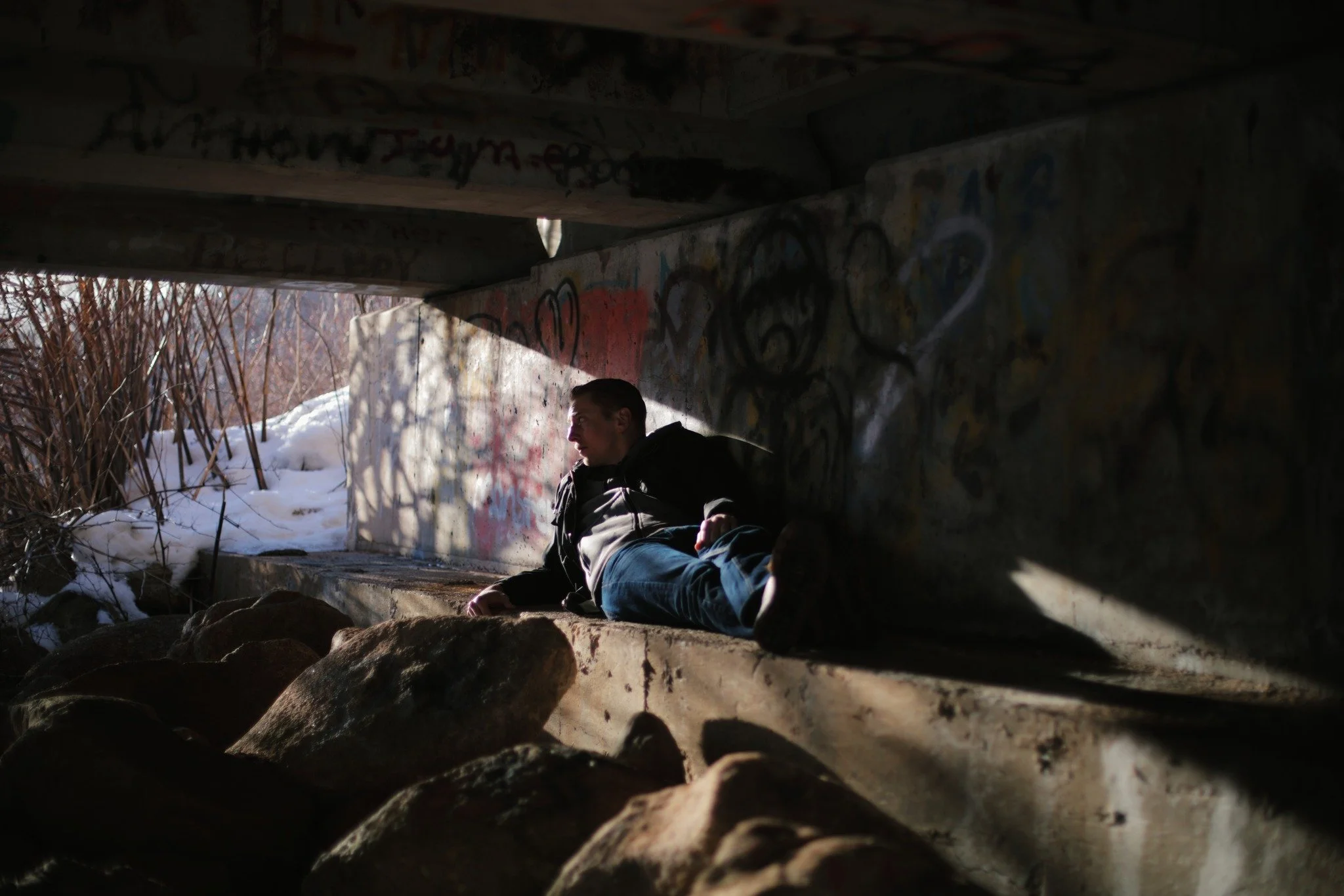 THE SEARCH &mdash;&mdash; The spots where snow rarely reaches call me earnestly now. Under bridges, hidden spaces, secret hangouts of local kids with little to do. I've never seen one here, but scattered graffiti gives them away like cave paintings. 
