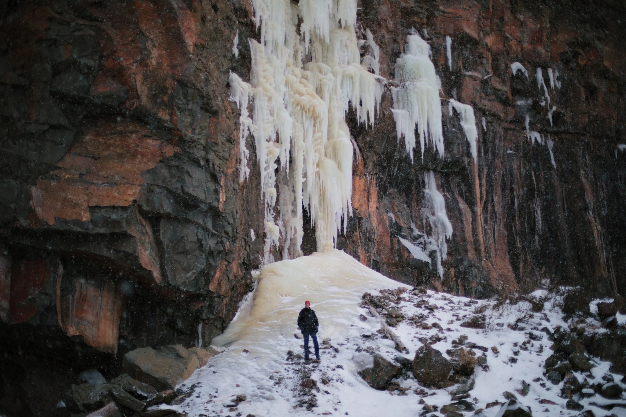 TIDELINE LIES &mdash;&mdash; We're slipping steady to the last days of icy cliffsides, waiting on a bit of bright sun to shake them of their burden. While we were here, a less-secure stalactite to the right came crashing. Thunderous demise by way of 