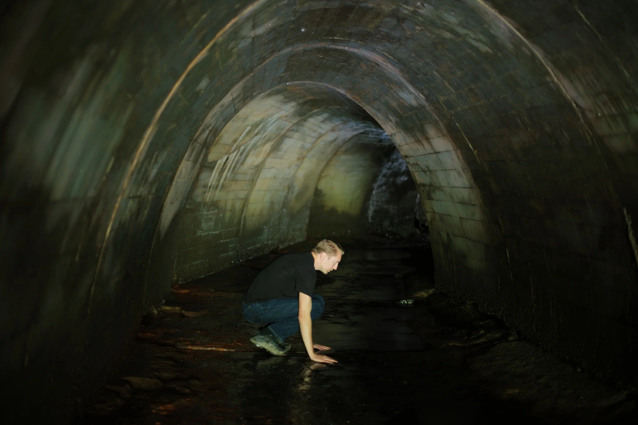 THIS WORLD DOWN &mdash;&mdash; Summer sends the streams to a trickle, and I hear the railway culverts calling me back. Tunnels settled deep under the earth of a railbed high ahead, because somewhere for the water to escape was essential. This dark sp