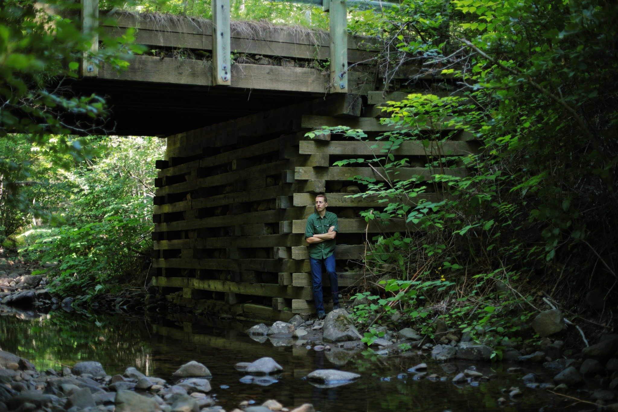 HERE SIGHS &mdash;&mdash; The old wooden cribbing bridges are the last of their kind. You'll only find them now on sporadically maintained dirt lanes, backwoods roads with less traffic and lower demand on weight. Exceeding simple structure, raised wi