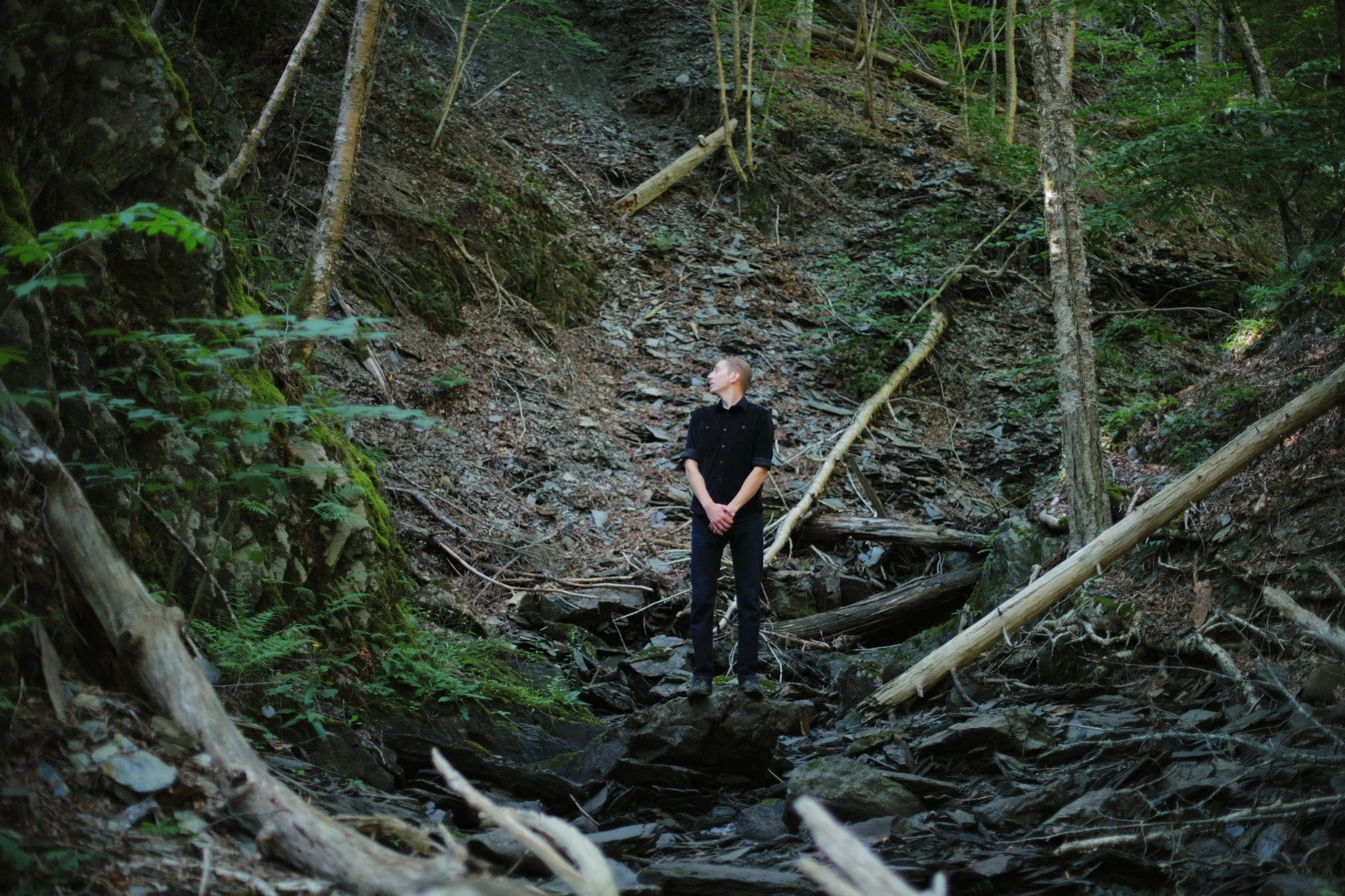 THUNDERING &mdash;&mdash; Here at the narrowest, deepest point of all the Kniffen Brook hollow, sharp shards of slate underfoot remind me of the money once made here. Back in the days when every child carried a tablet to school made from that materia