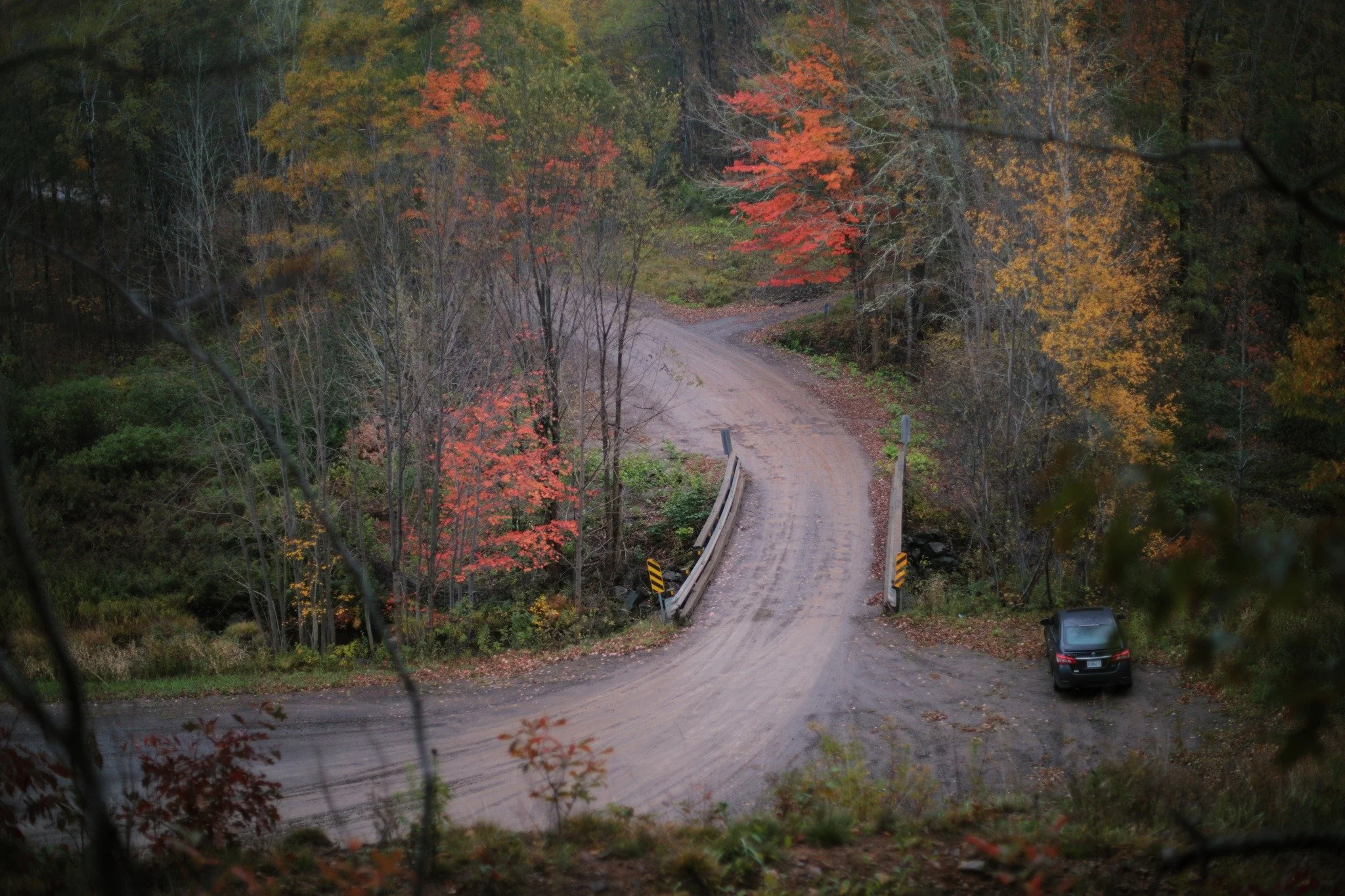 RAINY WASH &mdash;&mdash; Every abrupt drop has a hold on my heart, steep cliffs and precarious places. Uhlman Branch is a sleepy road, and if it weren't on the way to a dump, you'd expect far less activity. I park by Whitman Bridge now and then to f