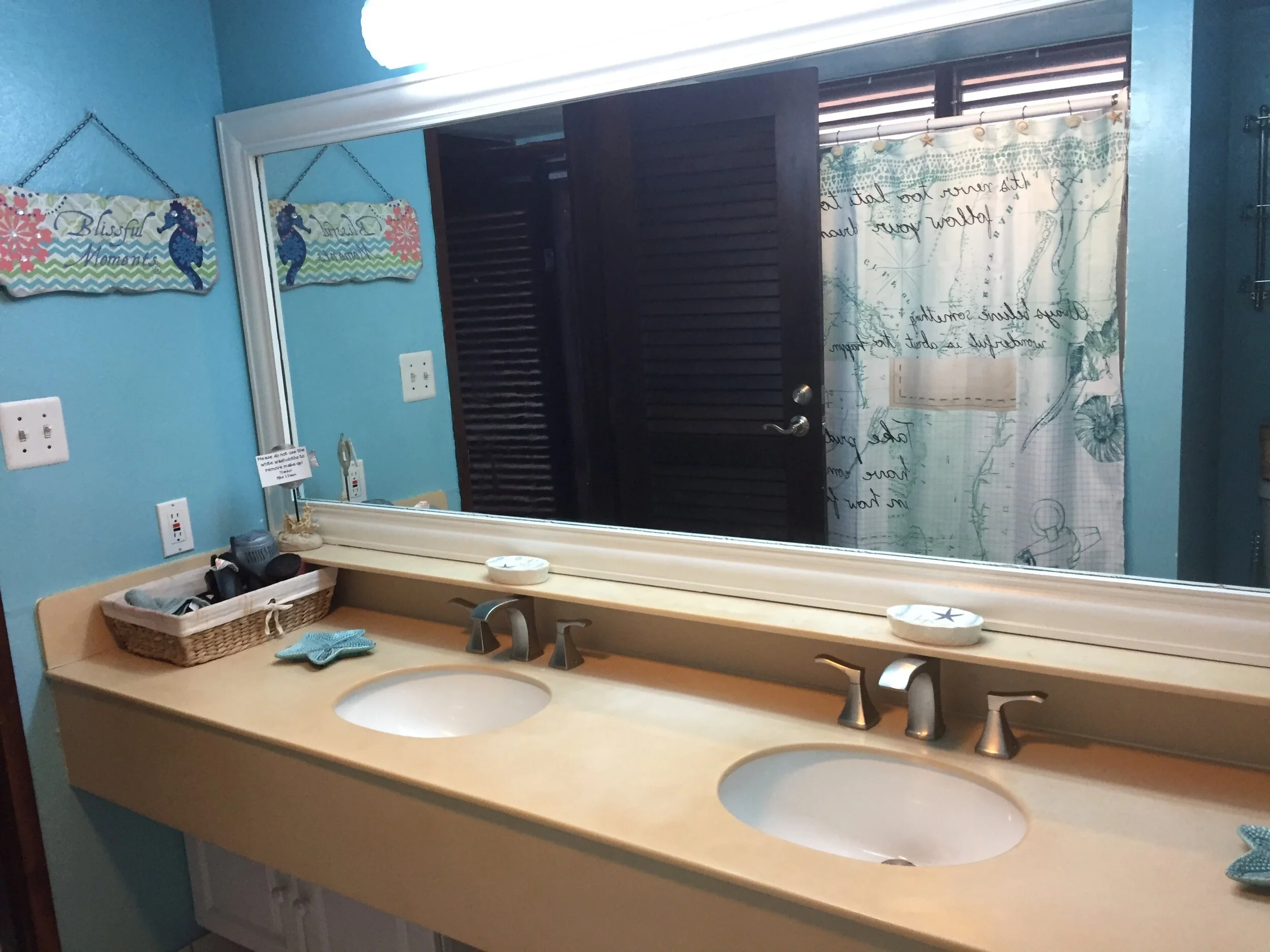 Tile shower, hair dryer and straightener.