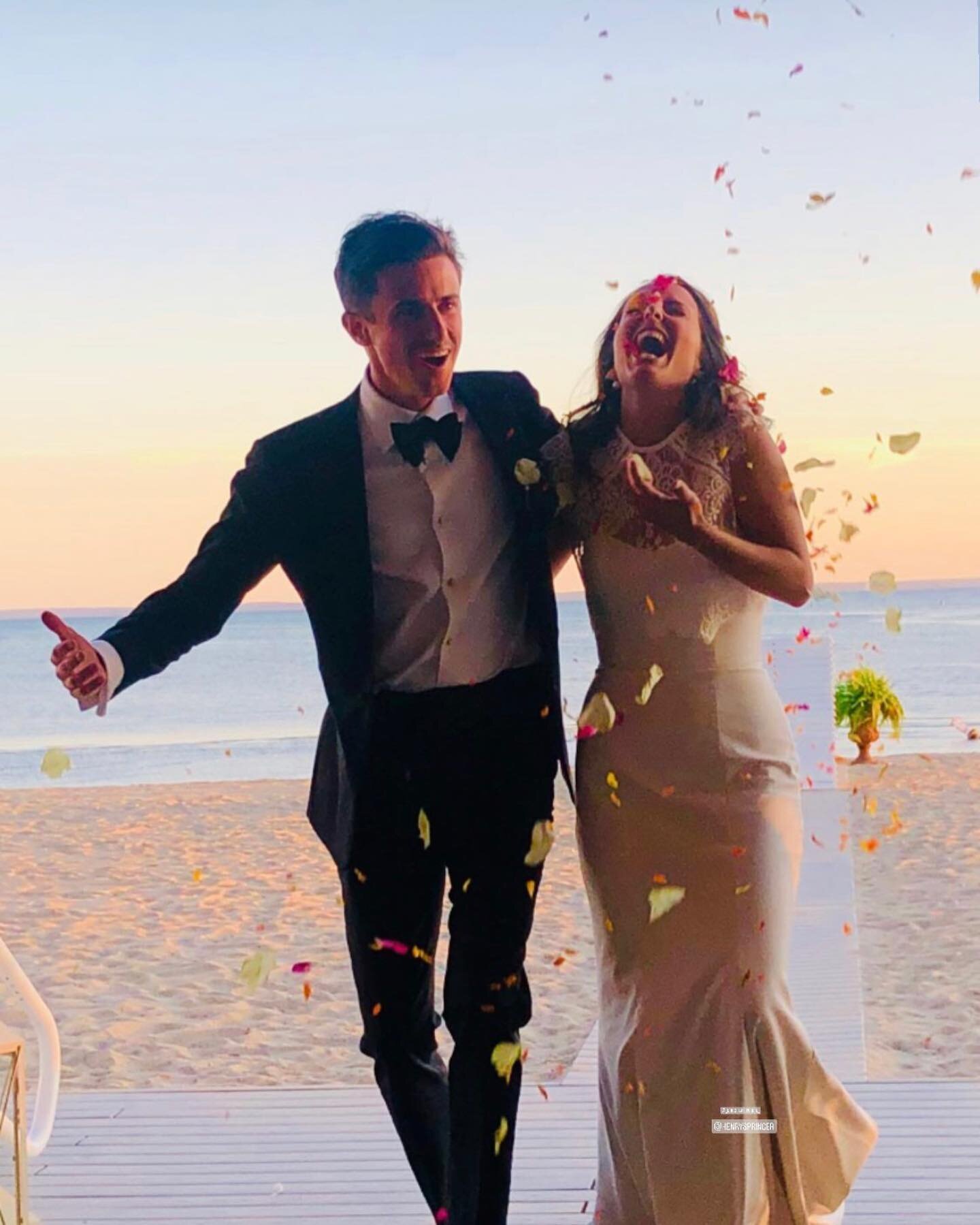 I think I&rsquo;ll start a new tradition: tossing flower petals at the bride and groom as they enter their reception and do their first dance. This amazing shot was taken by the bride&rsquo;s sister and captures the joy on the faces of this great cou