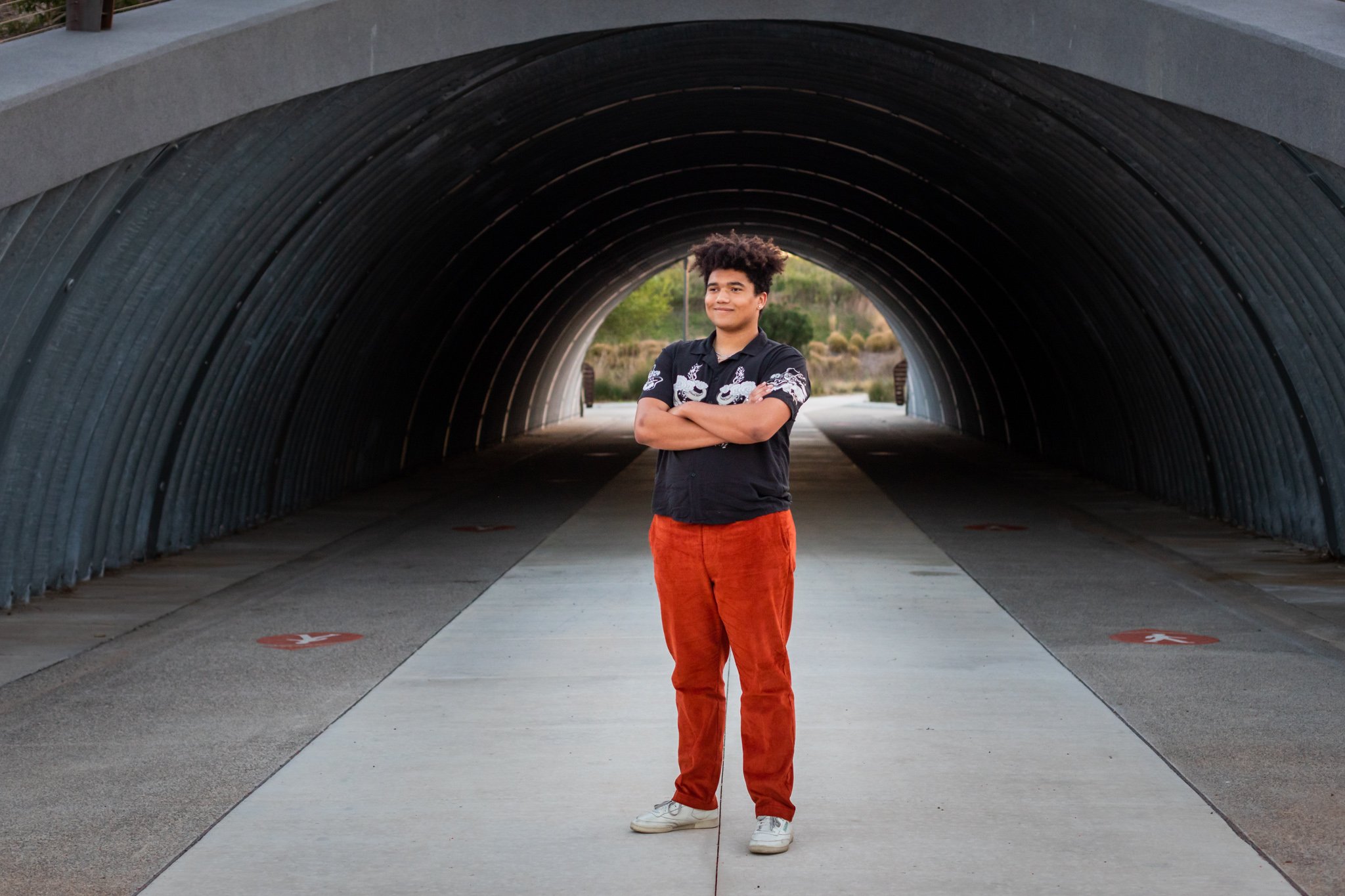 Senior Guy pictures standing under tunnel
