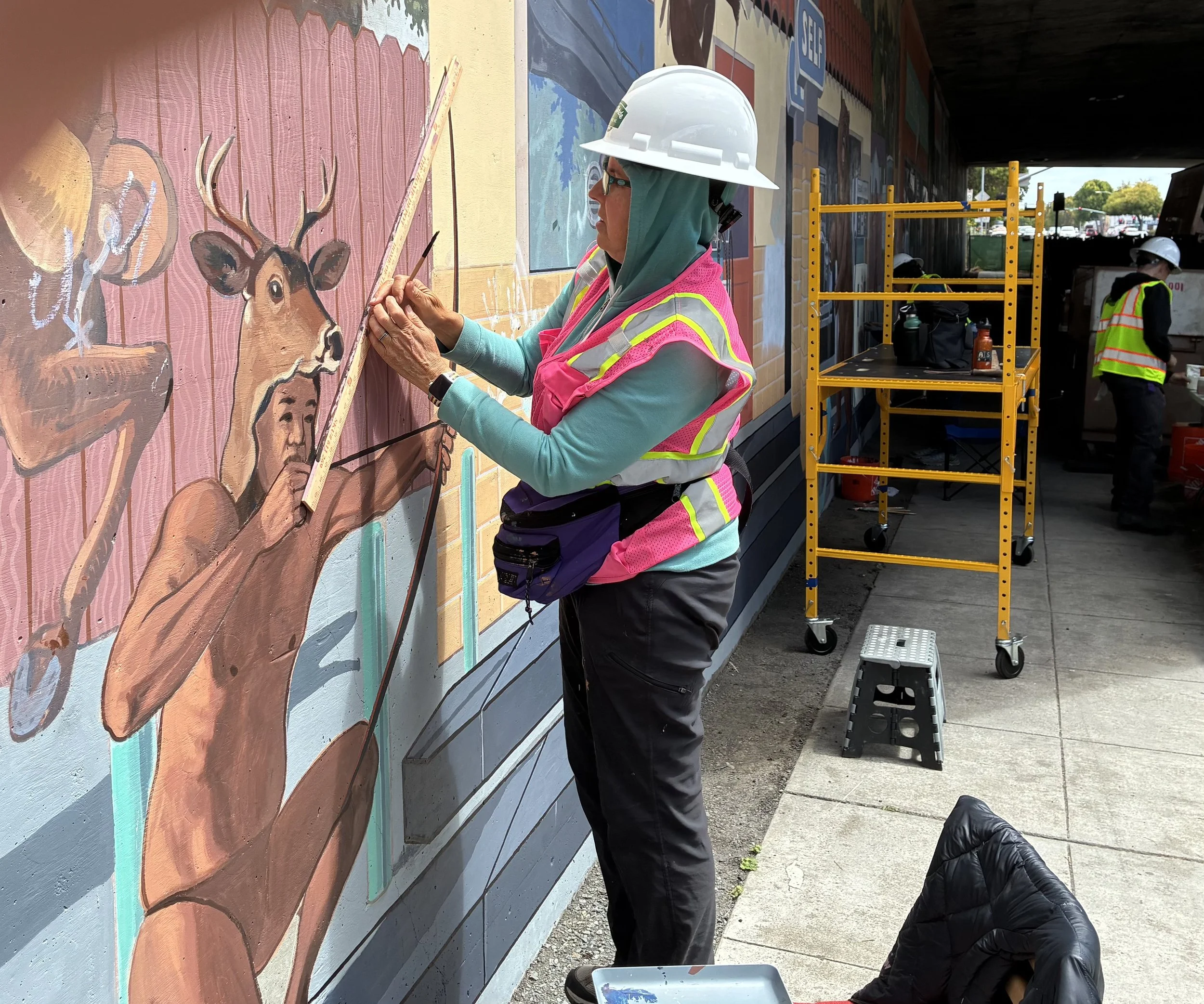 Restoration of "Revisionist History," a mural painted in 1991 by John Wehrle.