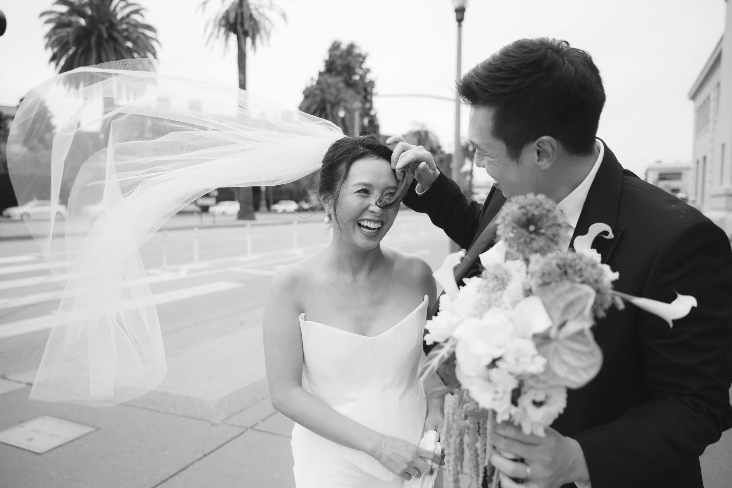 Proof that elegance and chaos can exist in the same frame 🌬️ 

//

#sanfranciscophotographer #documentaryweddingphotographer #sfcityhallweddingphotographer #sanfranciscocityhall #civilceremony