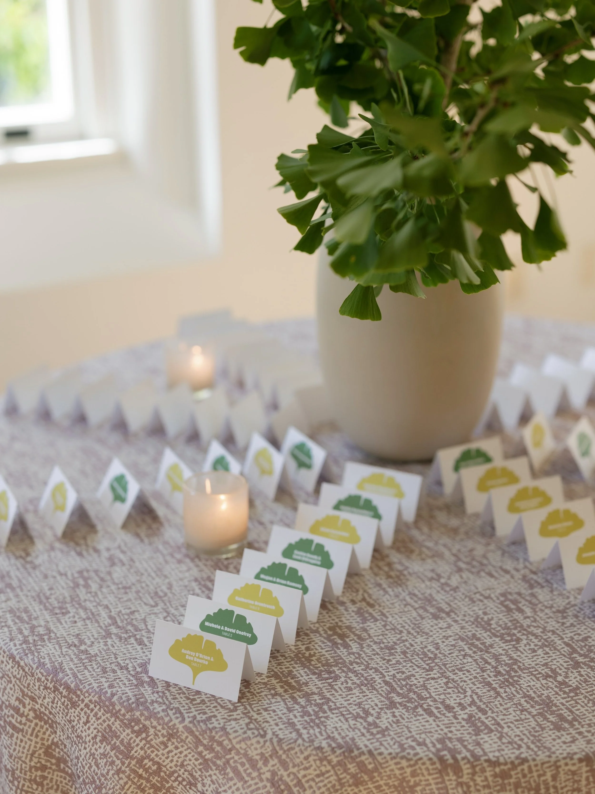 A little moment of arrival. An escort card display layered with organic greenery, candlelight, and the prettiest paper details, setting the tone before guests even took their seats. 🌱

Planning + Design @parkernicholsevents
Photography @elizabethpis