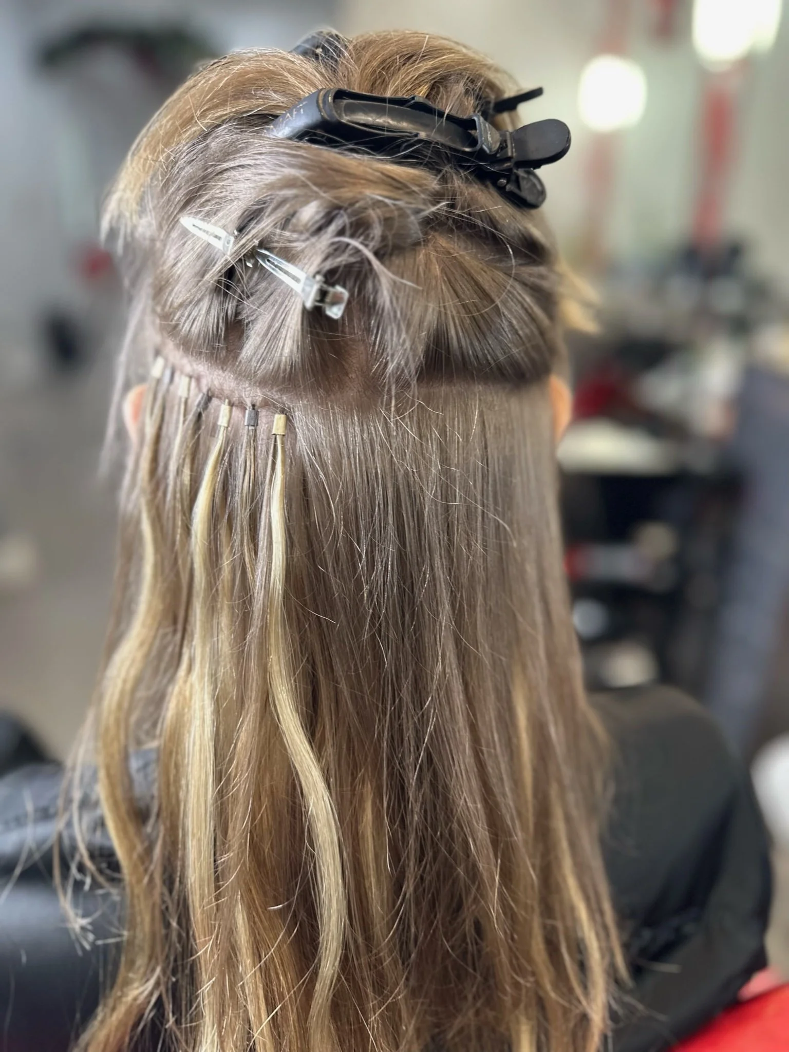 I-tip hair extension installation on brown hair with blonde highlights — Le Rêve Granada Hills