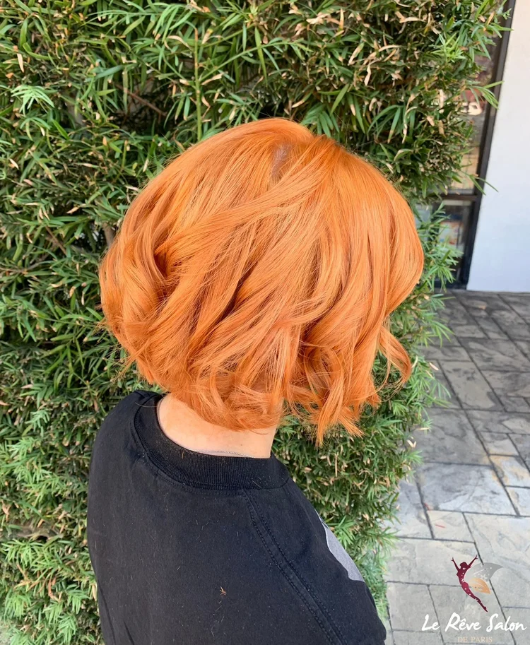  Copper orange hair color on curled bob 