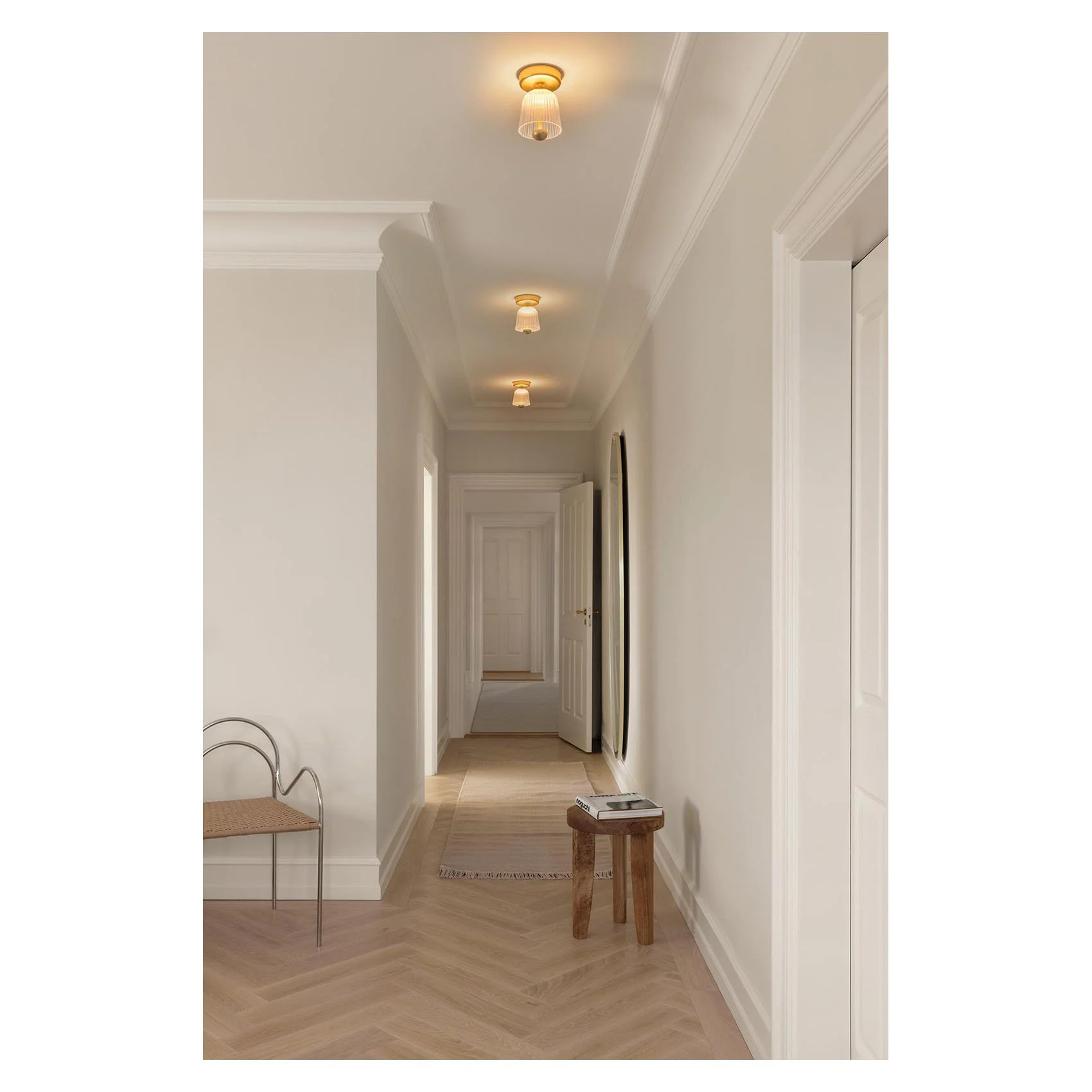 2176001_1_Nuura_AsteeaCeiling_satin brass_ripple clear_Lifestyle copy.jpg