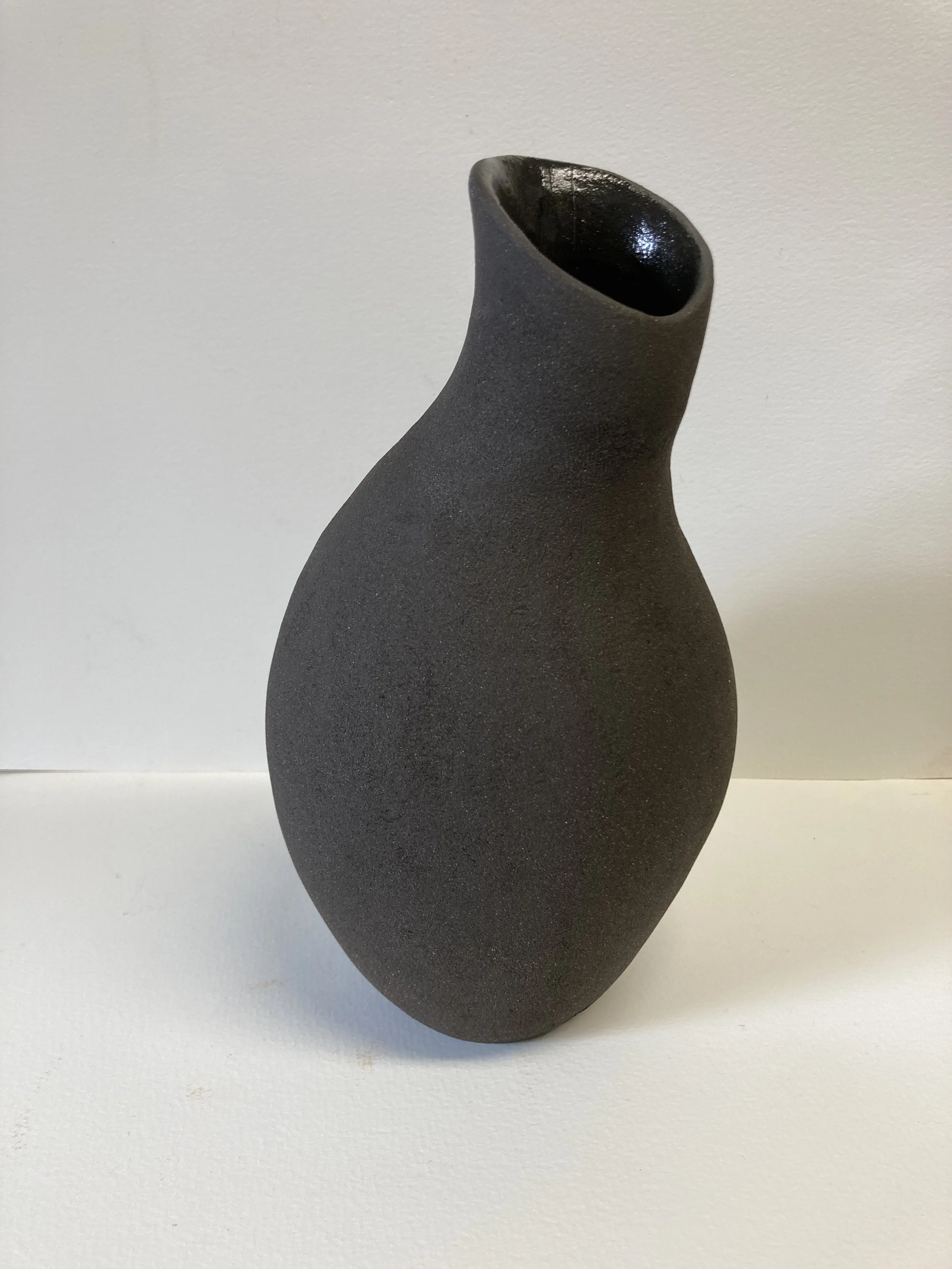 Black bodied coil pot