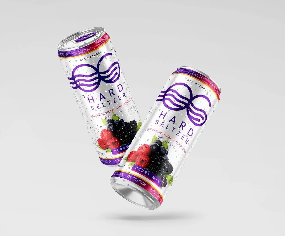 Two cans of Hard Seltzer with berry flavor, featuring images of blackberries, raspberries, and blueberries, labeled as sparkling water with alcohol, 6% alcohol by volume, all natural, gluten-free, and low sugar.