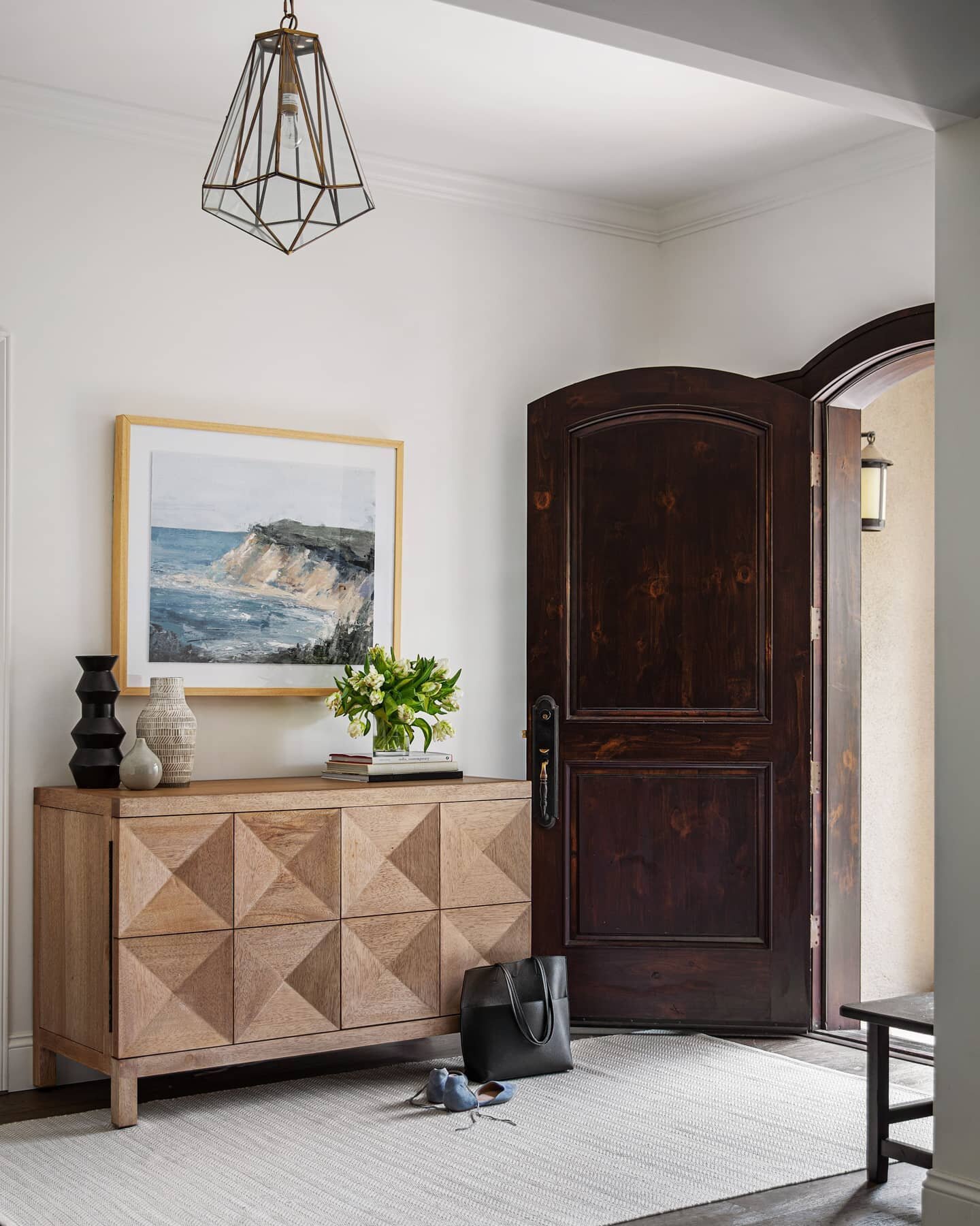 This week we'll be highlighting a few of our favorite spaces from an open-concept, organically inspired project. Beginning with this warm and inviting entryway!

Merging style with functionality, each piece is as unique as it is useful. Every entrywa