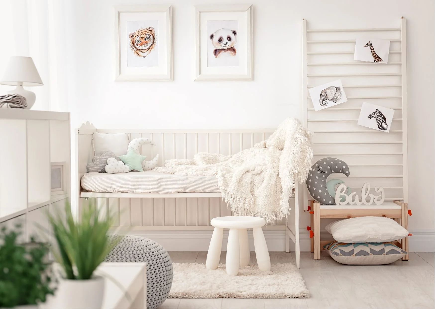 Soft-toned nursery with crib, star pillows, animal wall art, and cozy atmosphere.