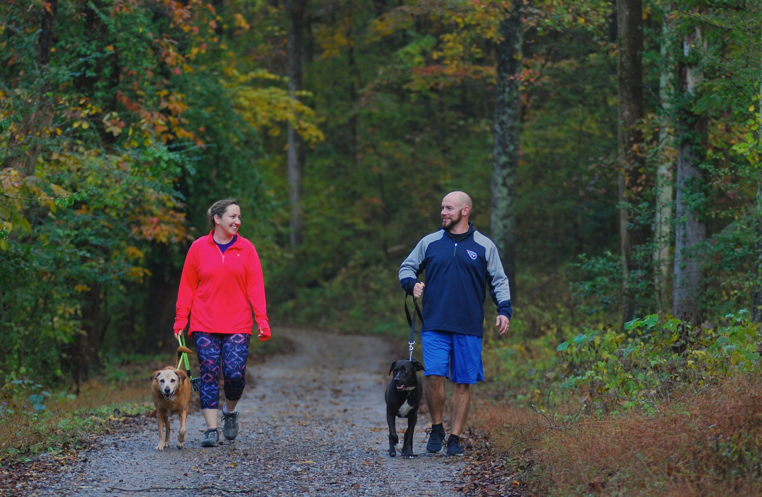 adult couple man woman with dog on trail hike.JPG