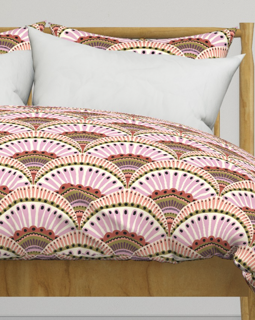 Duvet cover with blush and coral scallop fans that look like feathers, copyright Sandra Hutter.