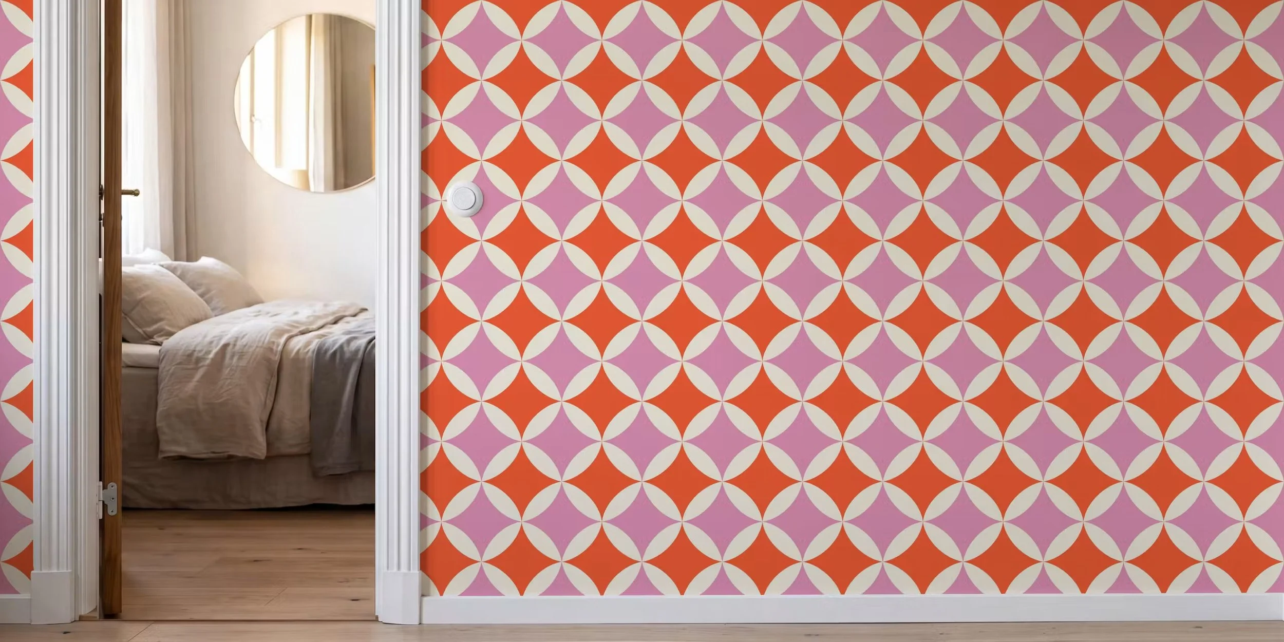 Tangerine and pink orange peel quilt block wallpaper in a hallway next to a bedroom door, copyright Sandra Hutter.